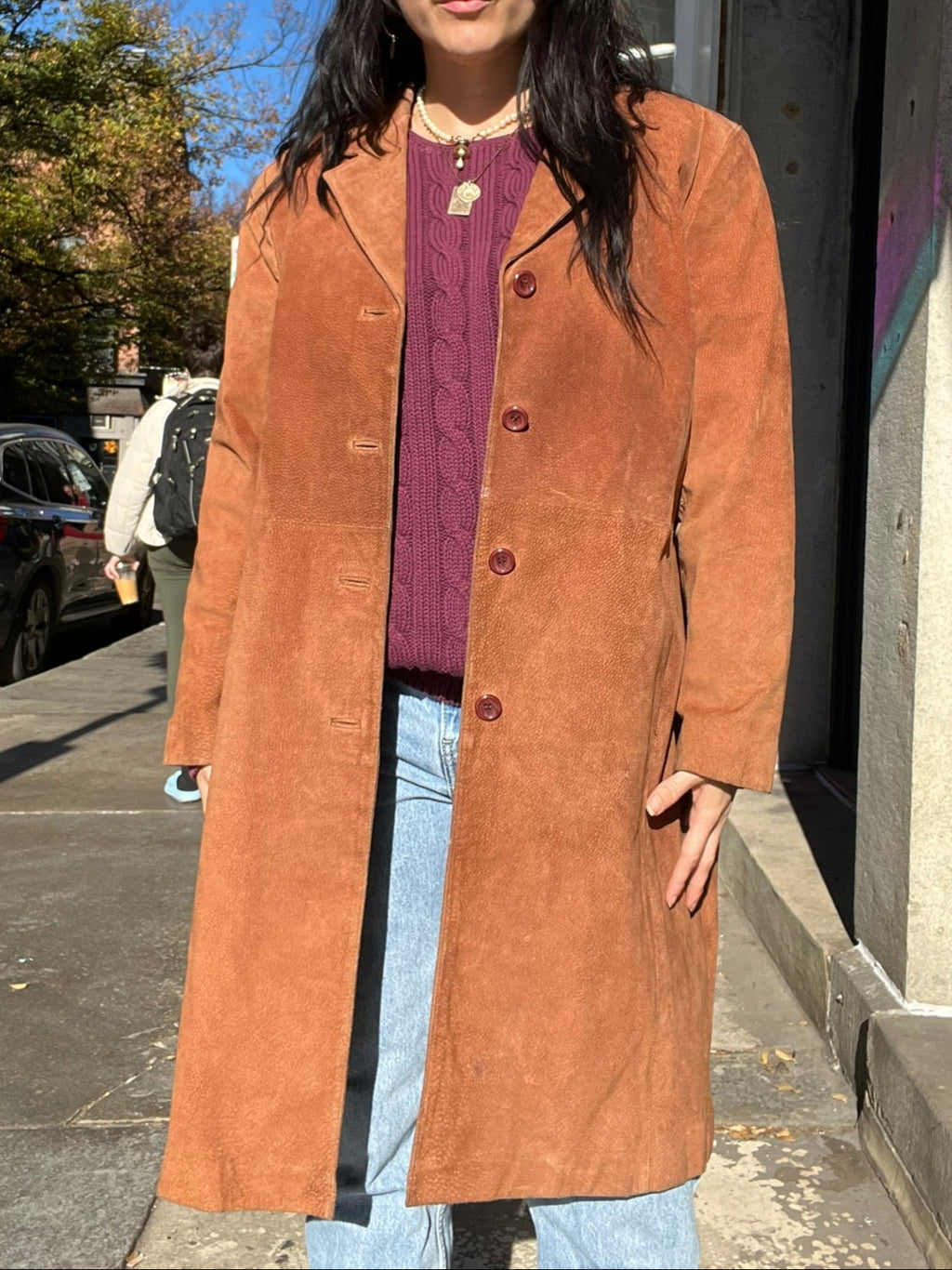 Elektra Vintage vintage suede coat in rich brown with classic collar and button details, displayed on a hanger.