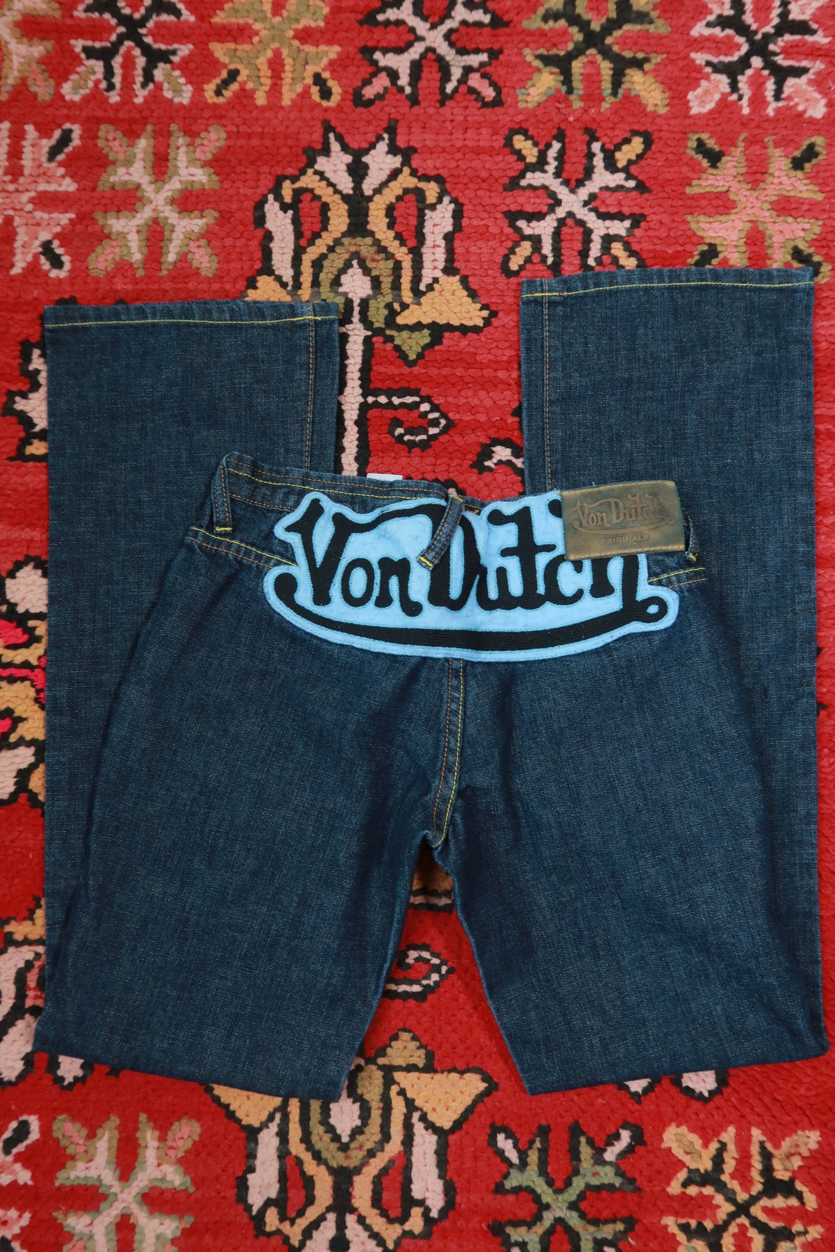 Dark wash vintage 2000s Von Dutch low rise bootcut jeans for women, size 27, from Elektra Vintage, denim bottoms with classic Y2K style.