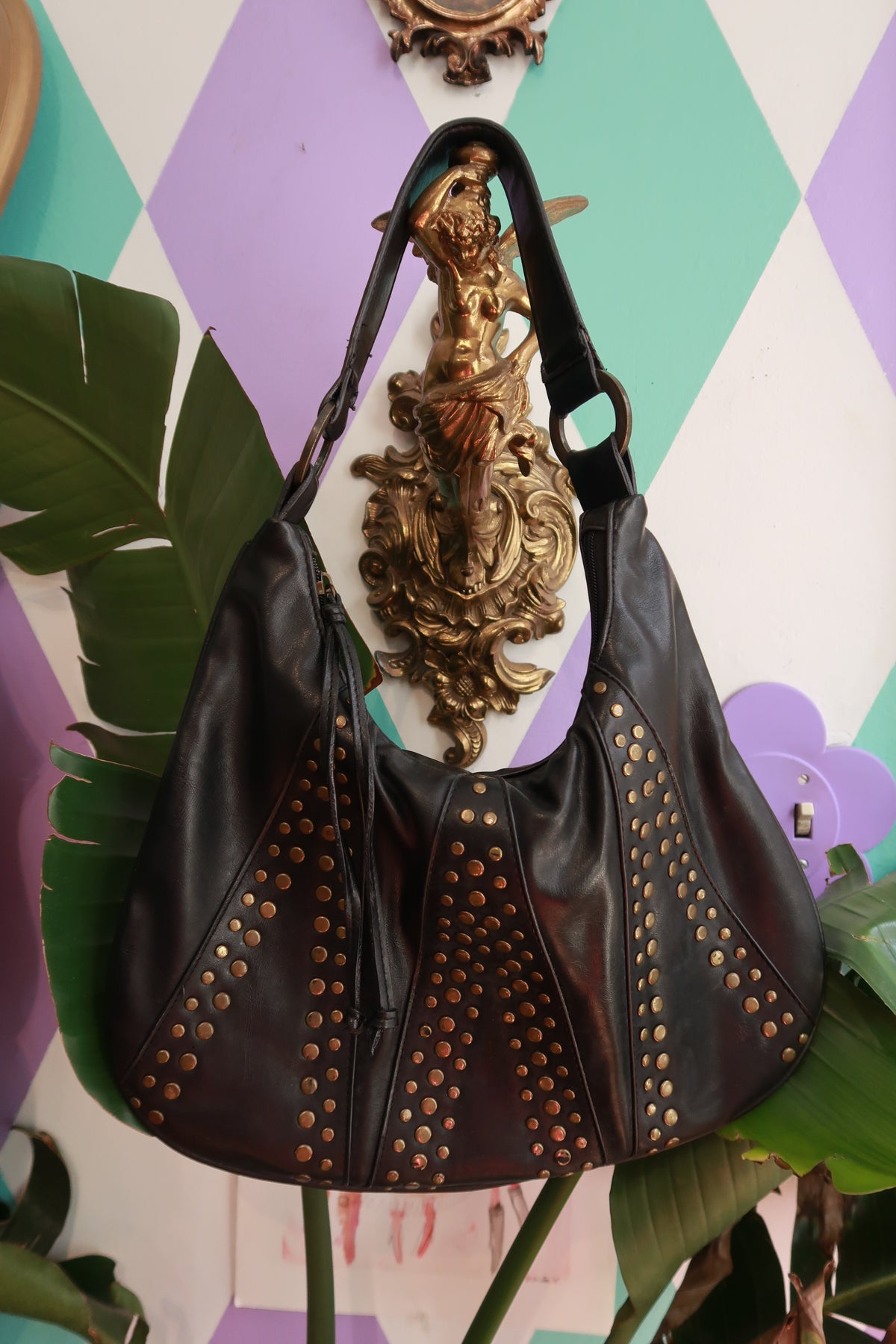 Elektra Vintage faux leather hobo shoulder bag with studded accents and a slouchy, vintage-inspired design.