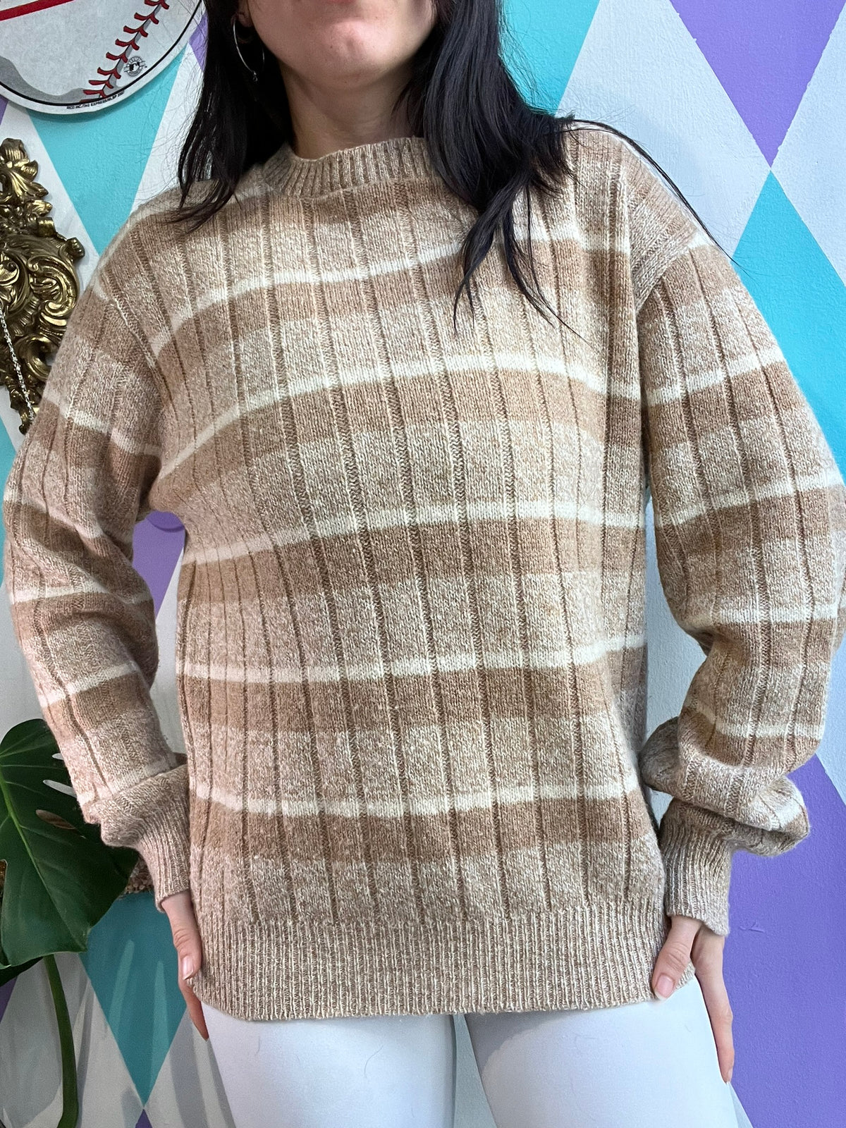Vintage tan striped sweater by Jantzen, featuring a classic design and ribbed cuffs, displayed on a neutral background.