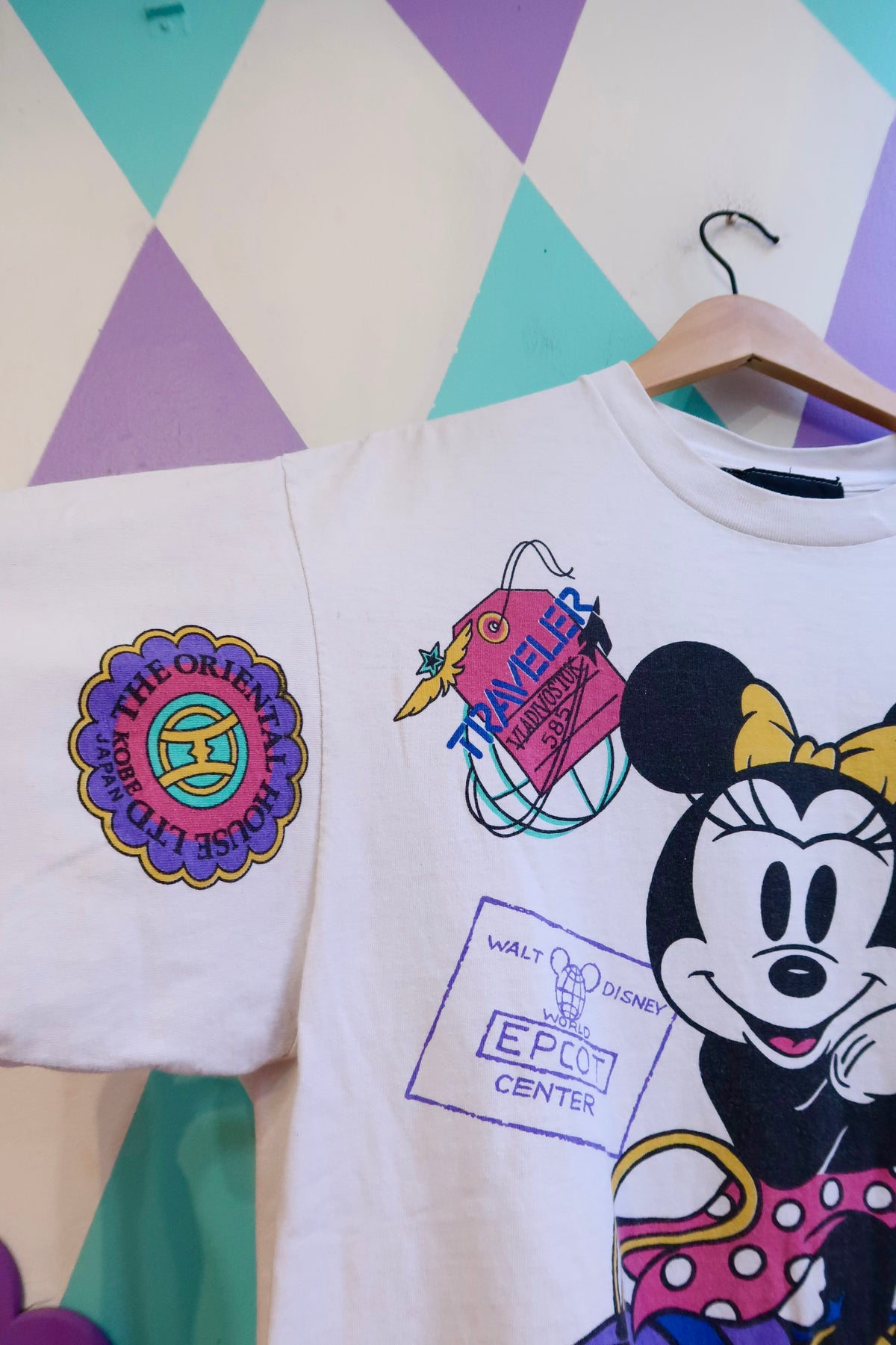 Vintage 90s Disney graphic tee featuring all-over print of Minnie Mouse and EPCOT design by Elektra Vintage.