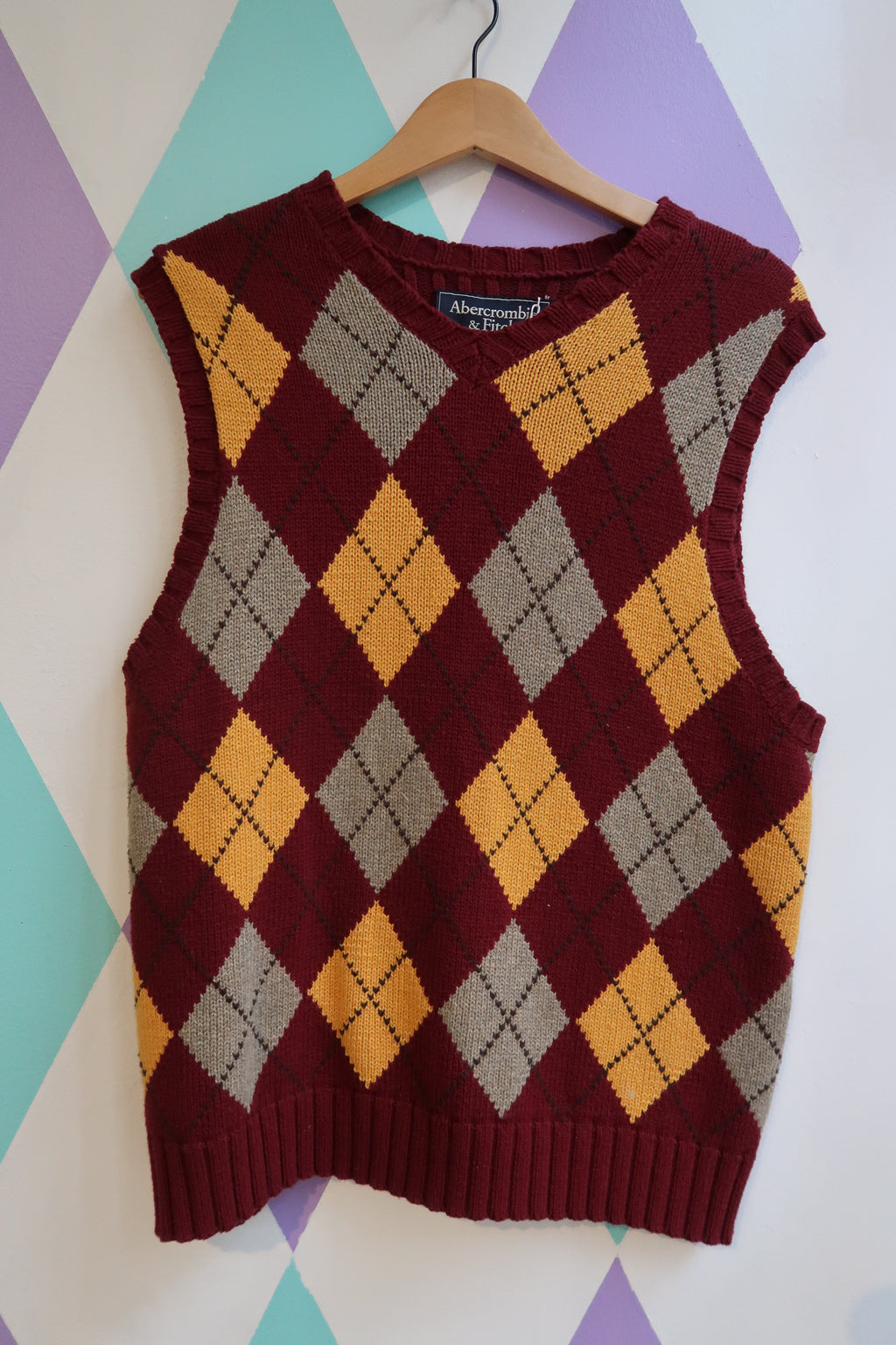 Elektra Vintage red and yellow argyle sweater vest with classic diamond pattern, sleeveless knit top from Abercrombie and Fitch.