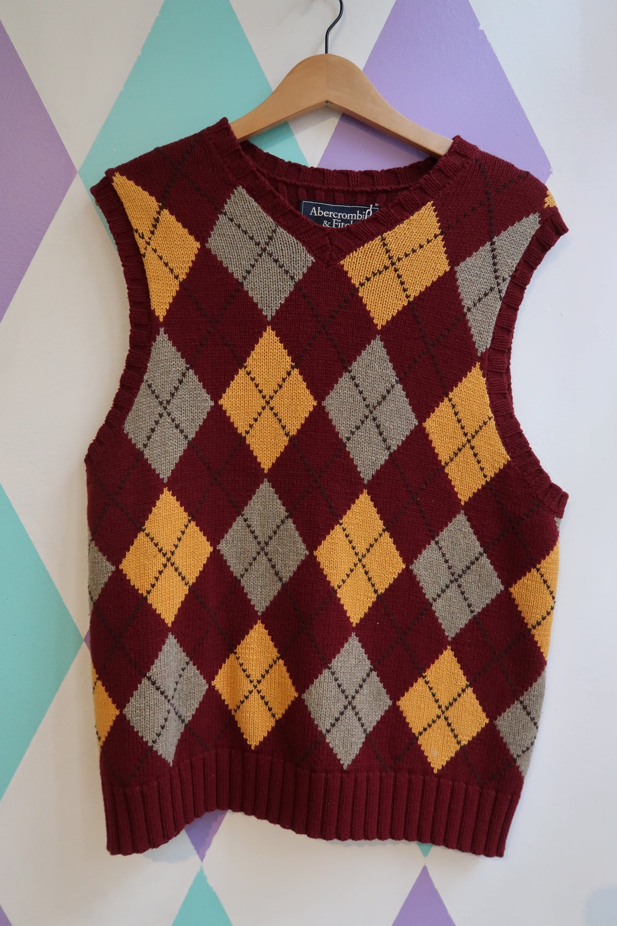 Elektra Vintage red and yellow argyle sweater vest with classic diamond pattern, sleeveless knit top from Abercrombie and Fitch.