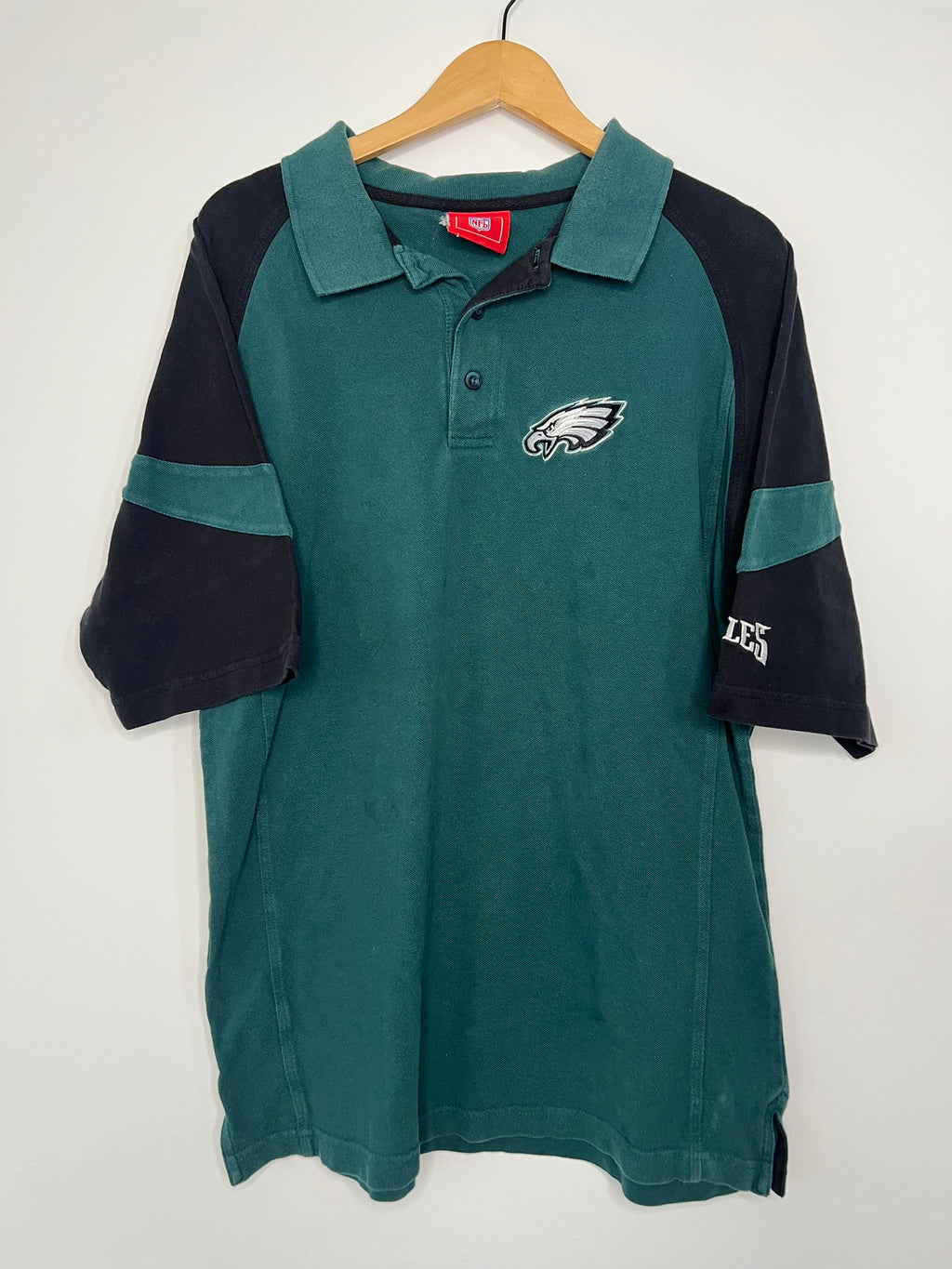 Vintage 2000s Eagles polo shirt by Elektra Vintage, featuring classic design and embroidered eagle logo on the chest.