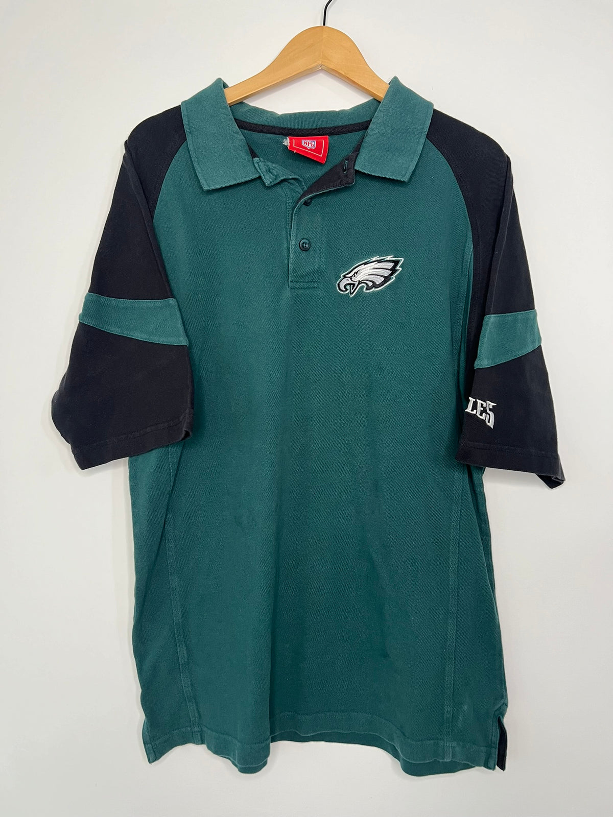 Vintage 2000s Eagles polo shirt by Elektra Vintage, featuring classic design and embroidered eagle logo on the chest.