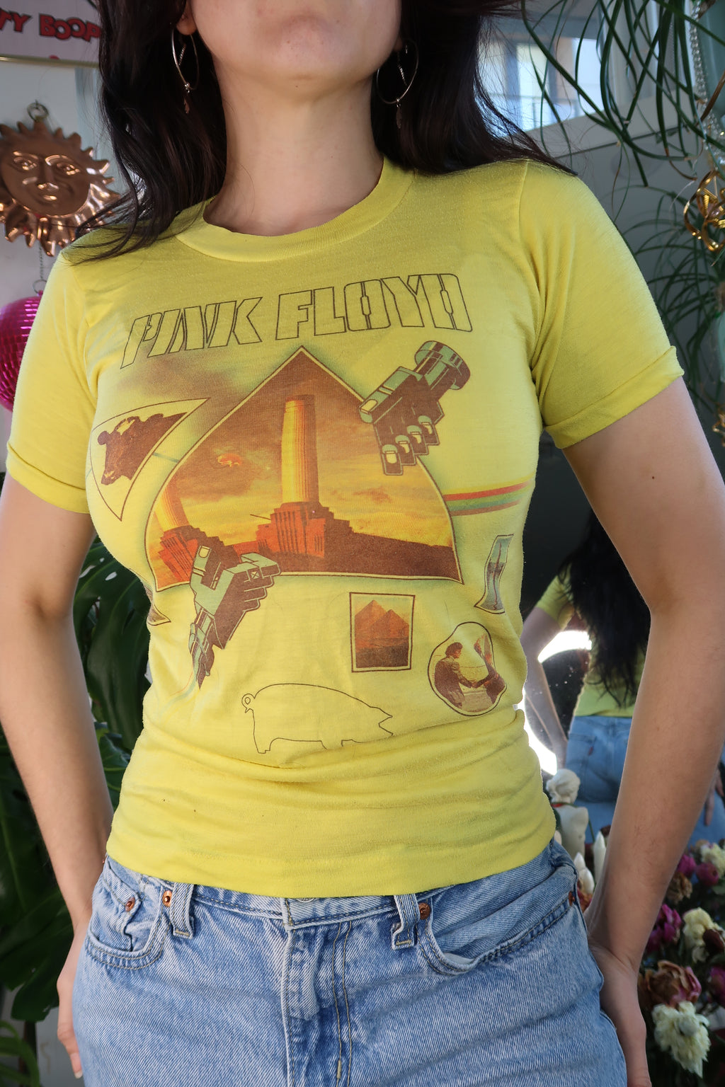 Women's vintage Pink Floyd Animals graphic T-shirt by Elektra Vintage featuring 1970s style pink tee with band artwork.