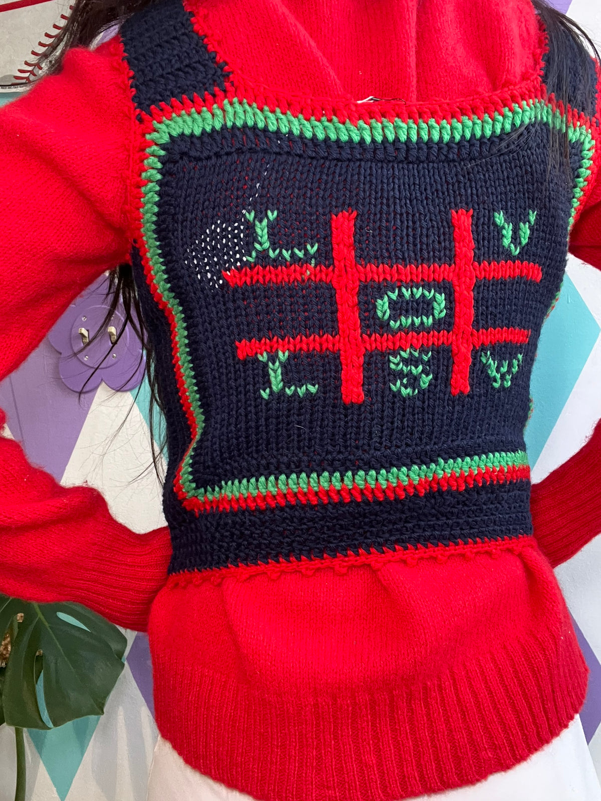 Women's vintage Apple sweater vest by Elektra Vintage, featuring classic knit pattern and retro style.