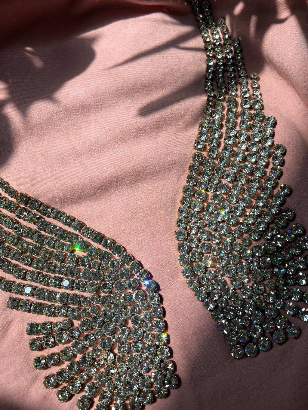 Women's hoodie with 2000s rhinestone angel wings design by Elektra Vintage, featuring sparkling embellishments on a casual top.