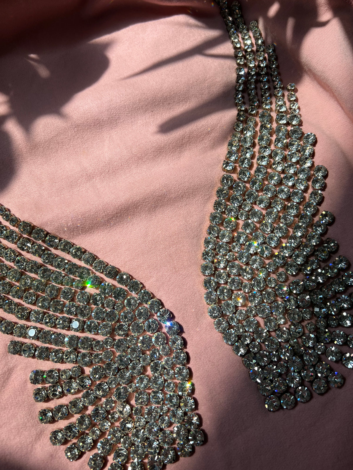 Women's hoodie with 2000s rhinestone angel wings design by Elektra Vintage, featuring sparkling embellishments on a casual top.