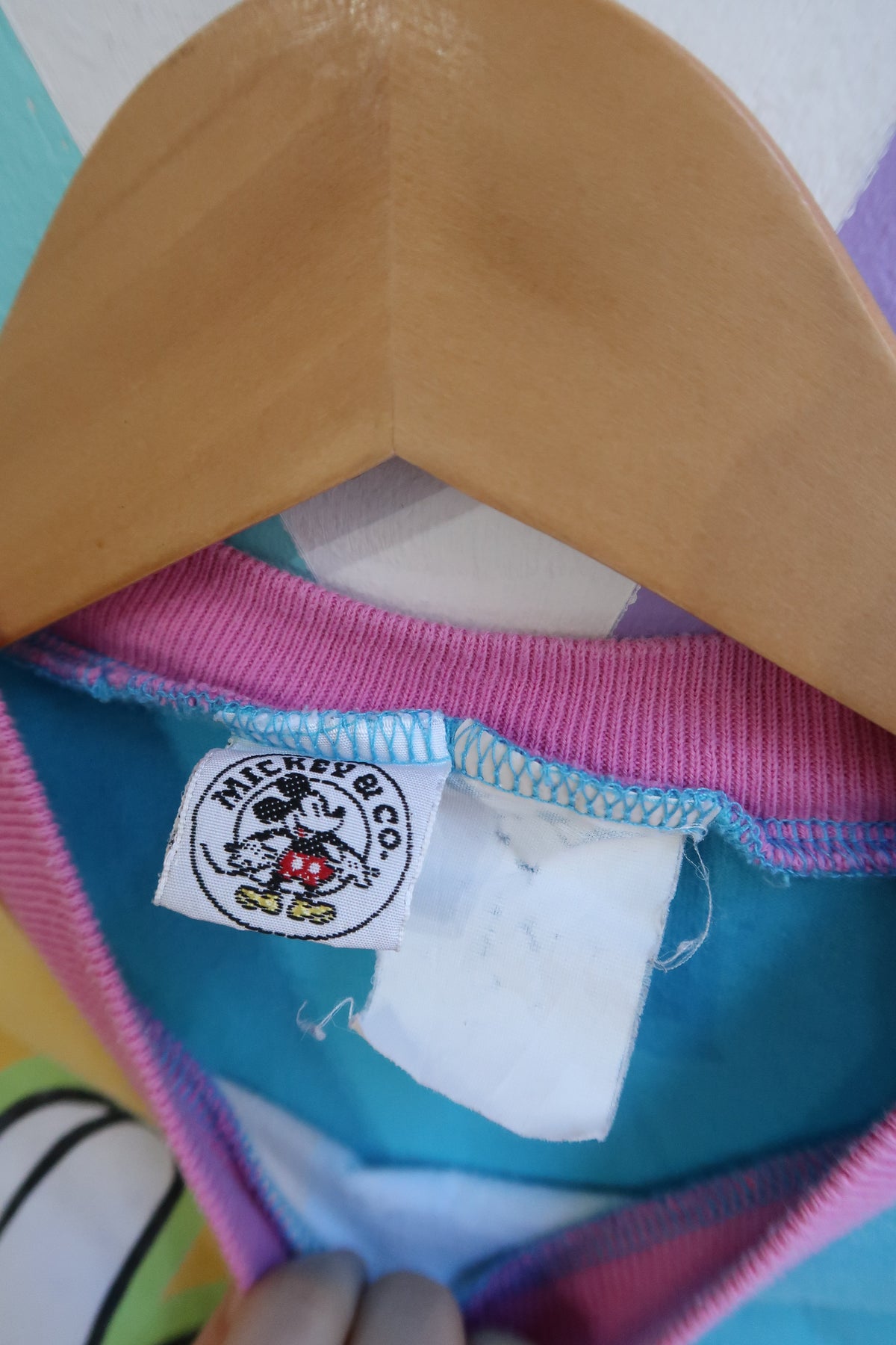 Vintage 90s Mickey Mouse colorblock graphic T-shirt for women by Elektra Vintage, featuring Disney all-over print design.