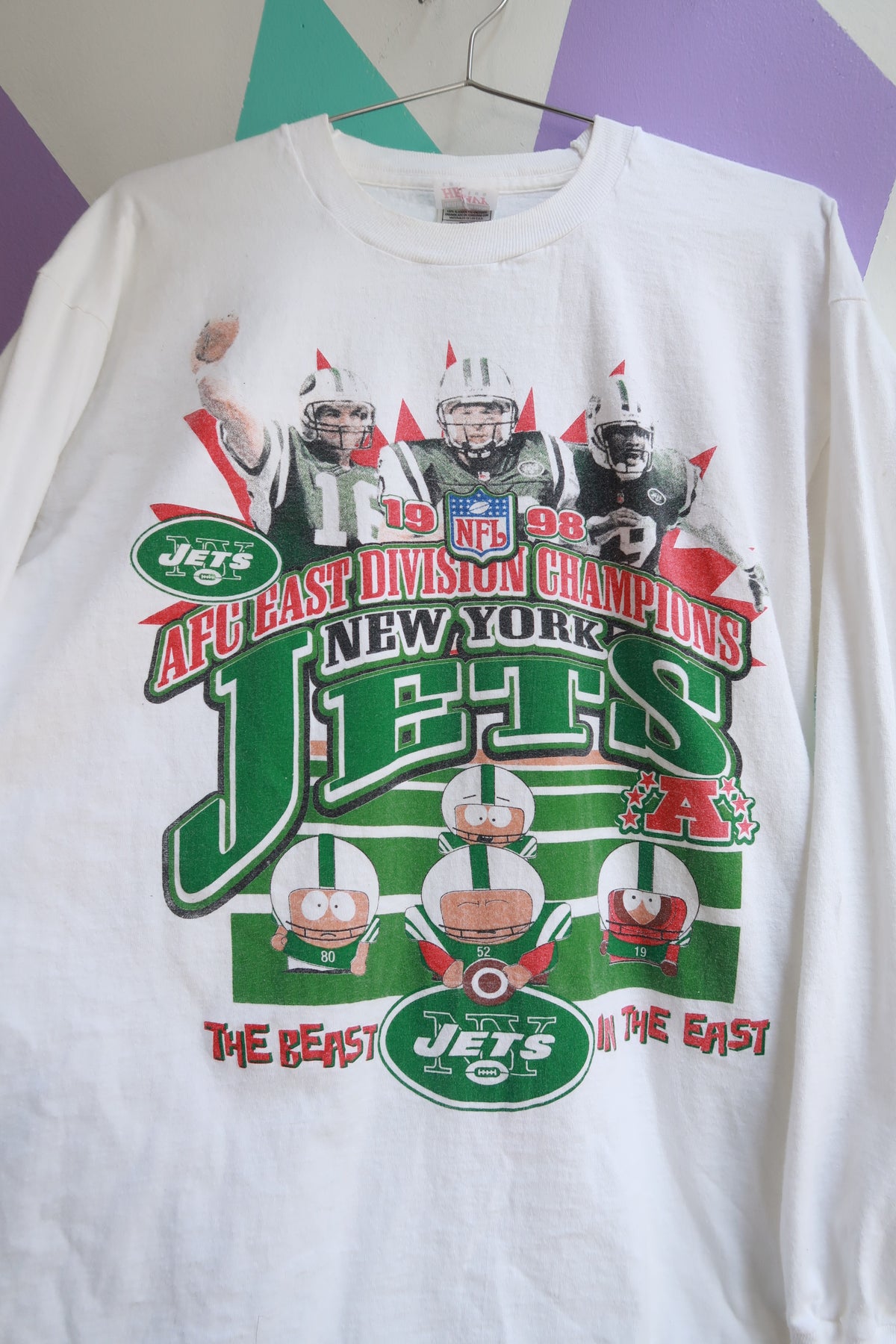 Men's vintage 1998 New York Jets South Park graphic AFC East Champions long sleeve tee by Elektra Vintage, featuring retro sports design.