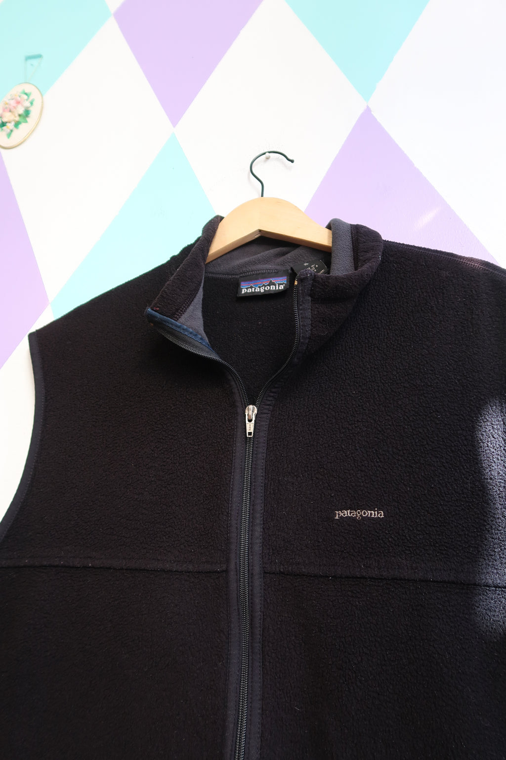 Men's vintage black fleece vest by Elektra Vintage, featuring a classic Patagonia-style fleece top with a cozy, textured fabric.