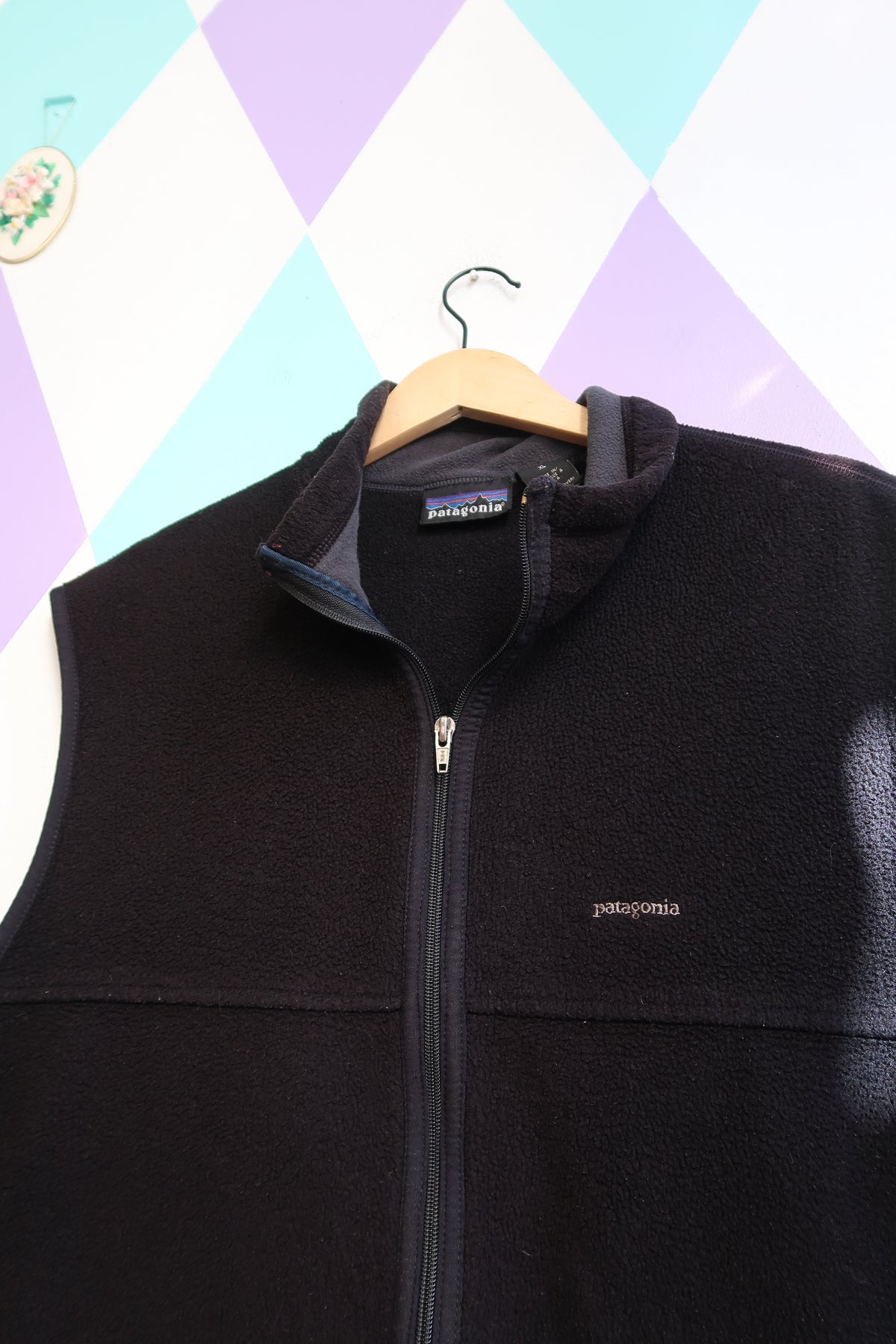 Men's vintage black fleece vest by Elektra Vintage, featuring a classic Patagonia-style fleece top with a cozy, textured fabric.