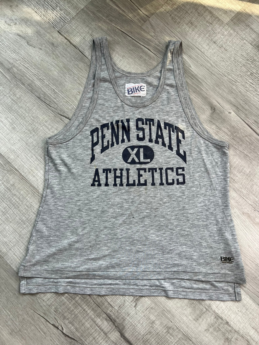 Vintage Penn State Athletics tank top by Elektra Vintage, featuring classic team logo and university colors.