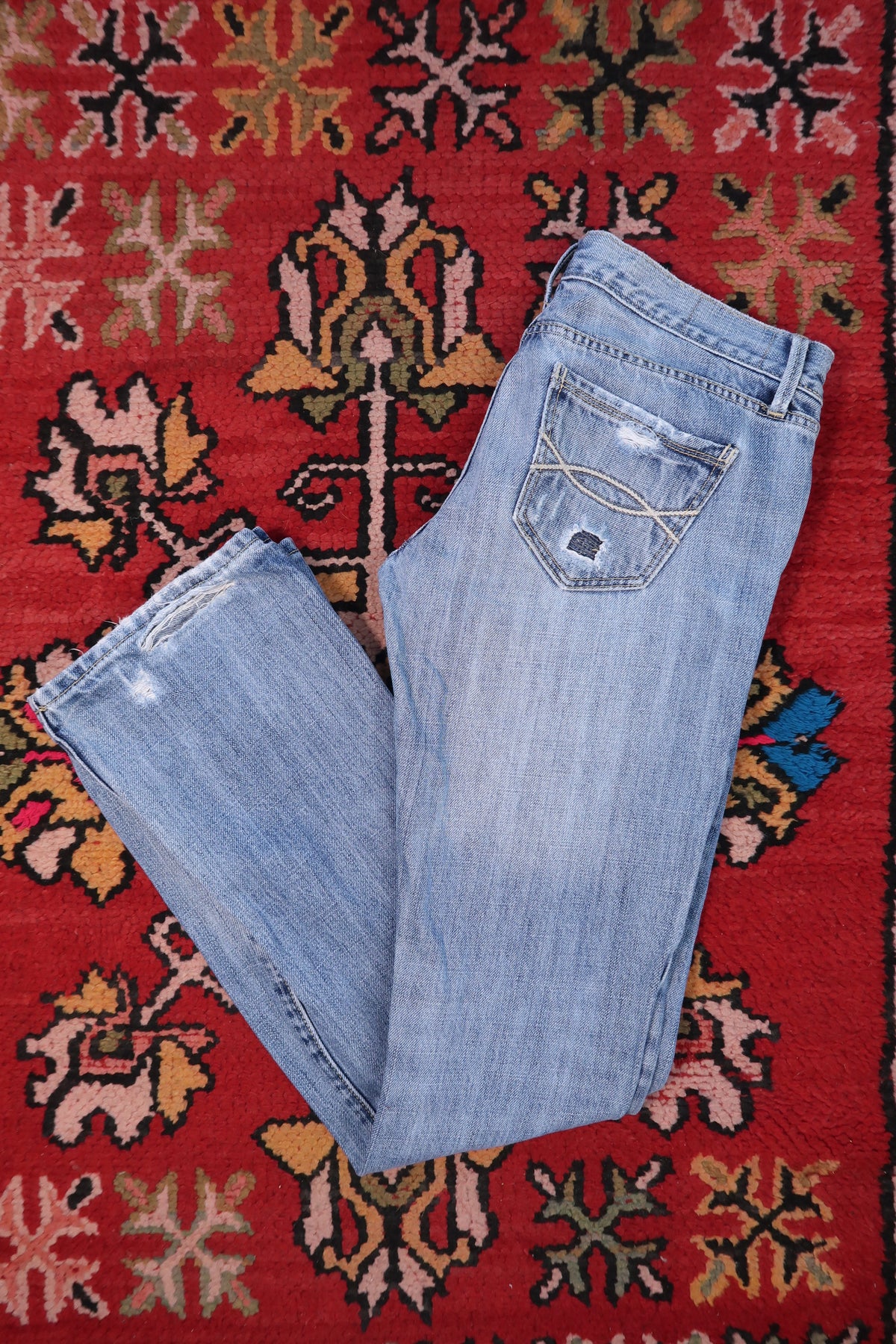 Elektra Vintage women's Y2K Abercrombie & Fitch distressed low-rise jeans with a relaxed fit and vintage wash denim.