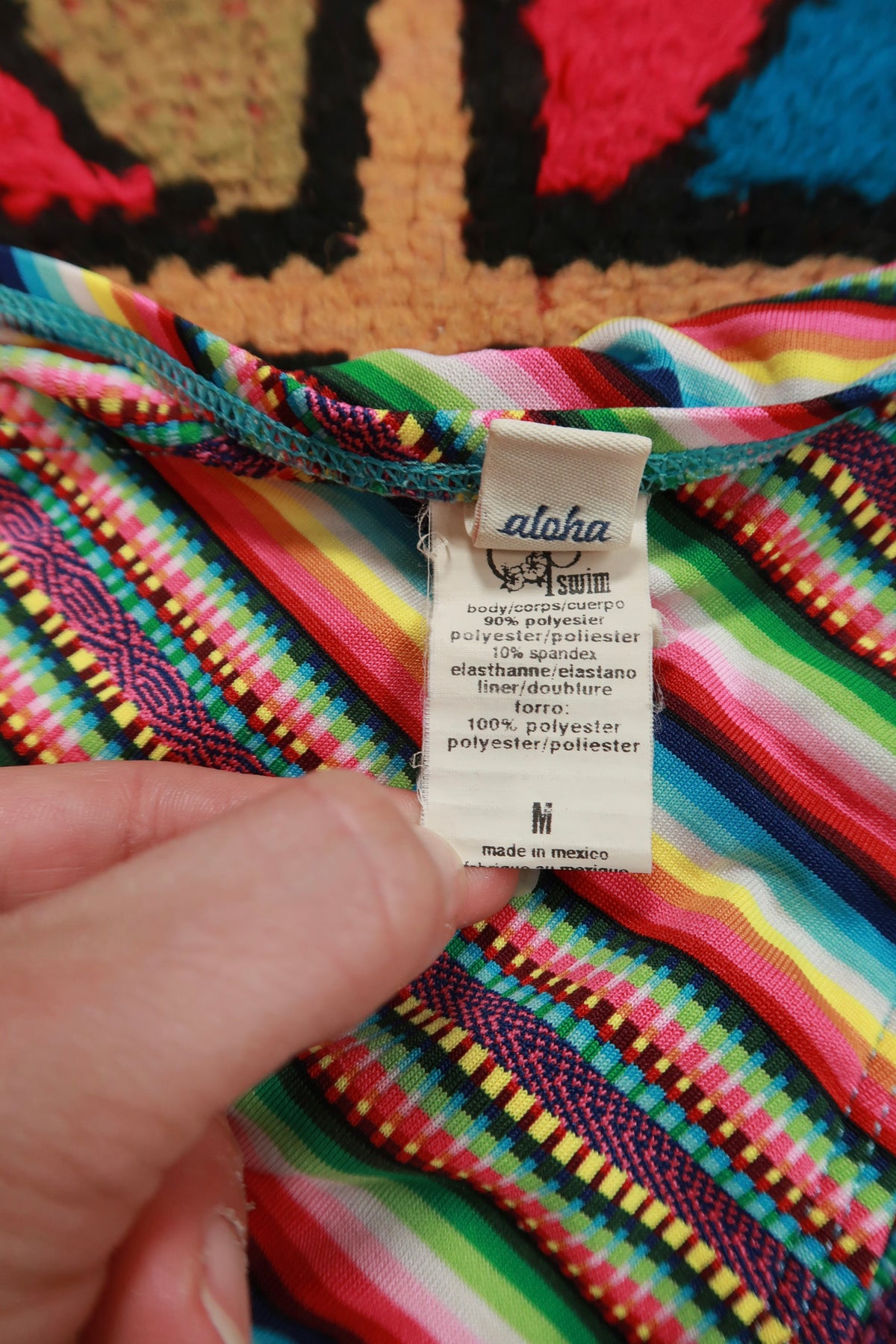 Vintage Y2K OP rainbow stripe tie side bikini bottoms for women by Elektra Vintage, featuring vibrant colorful stripes and tie sides.