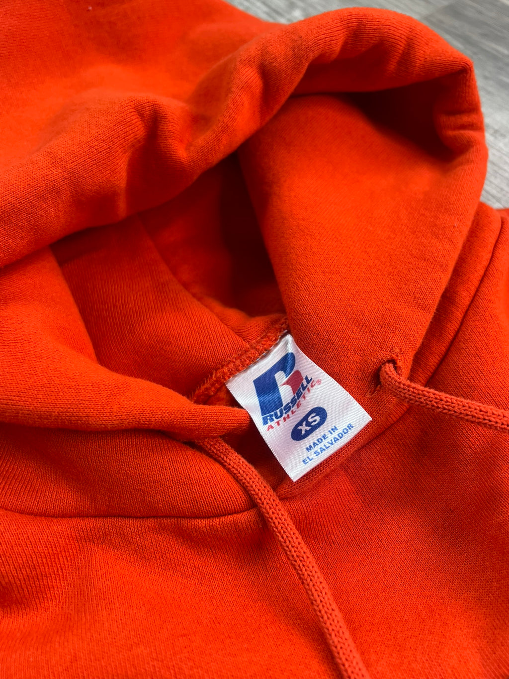 Vintage orange Syracuse University hoodie by Elektra Vintage, featuring university logo and classic hoodie design.