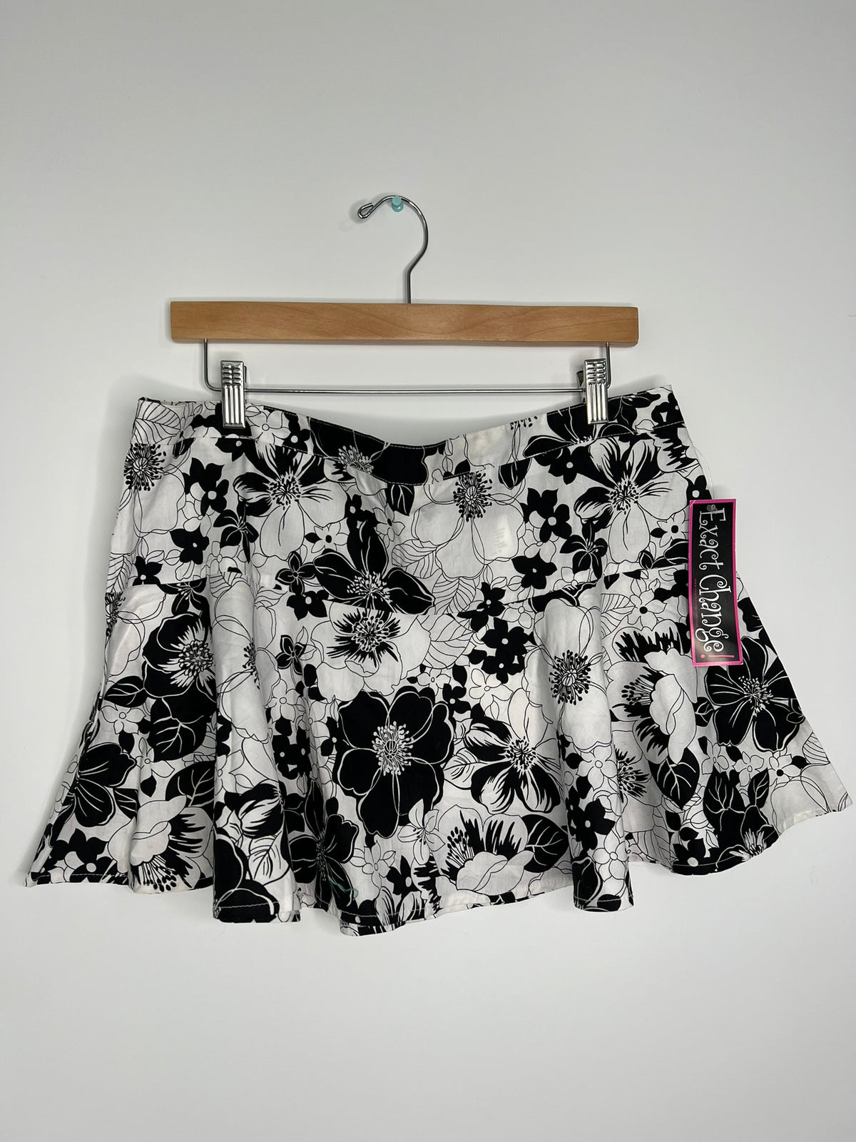 Vintage 2000s Elektra Vintage skirt with exact change pattern, high-waisted design, and retro style, shown on a hanger.