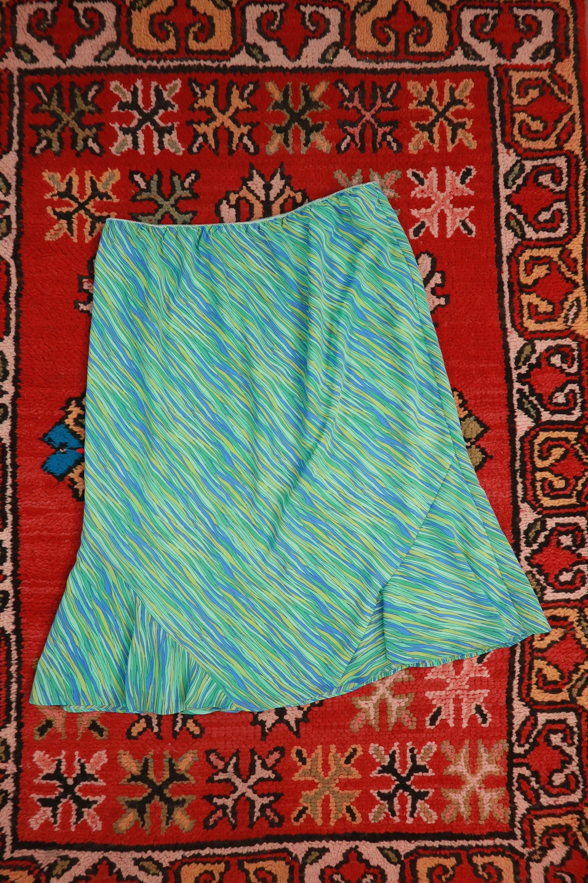 Elektra Vintage vintage Y2K blue green abstract print asymmetrical midi skirt with flowing fabric and unique design.