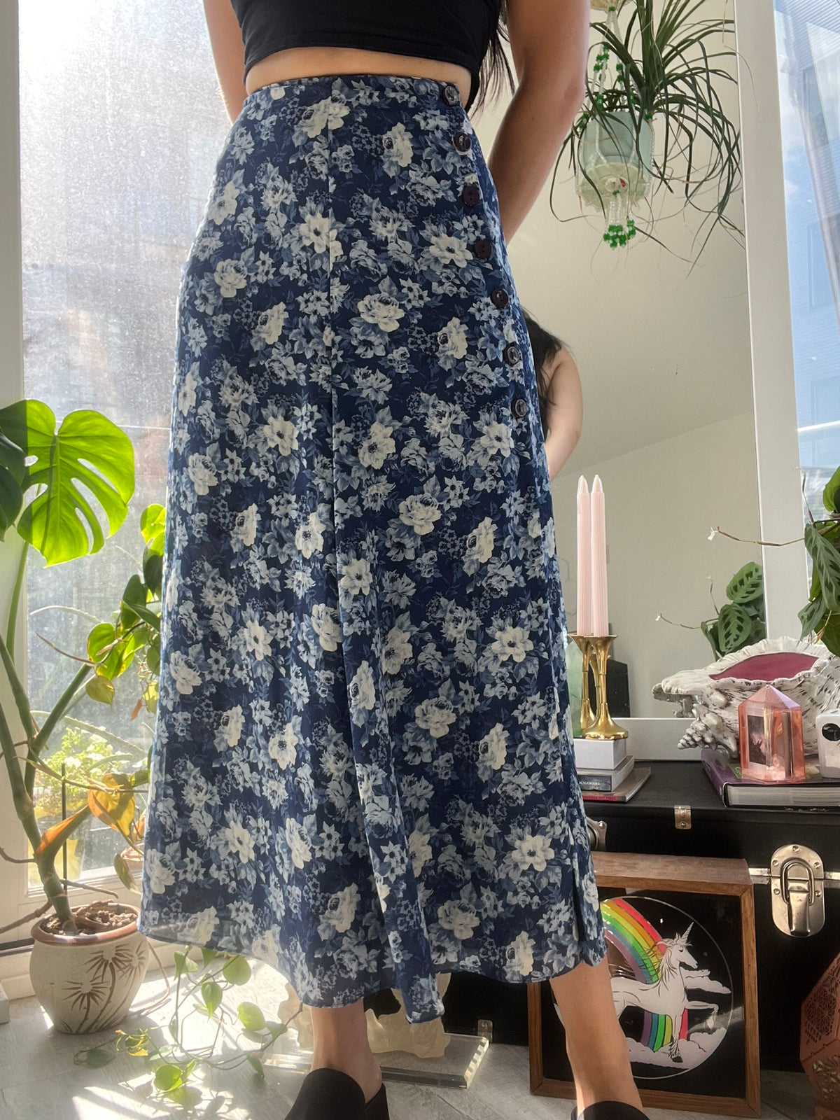 Vintage Elektra Vintage Express Blue Floral Midi Skirt with a flowing fabric and vibrant floral pattern.