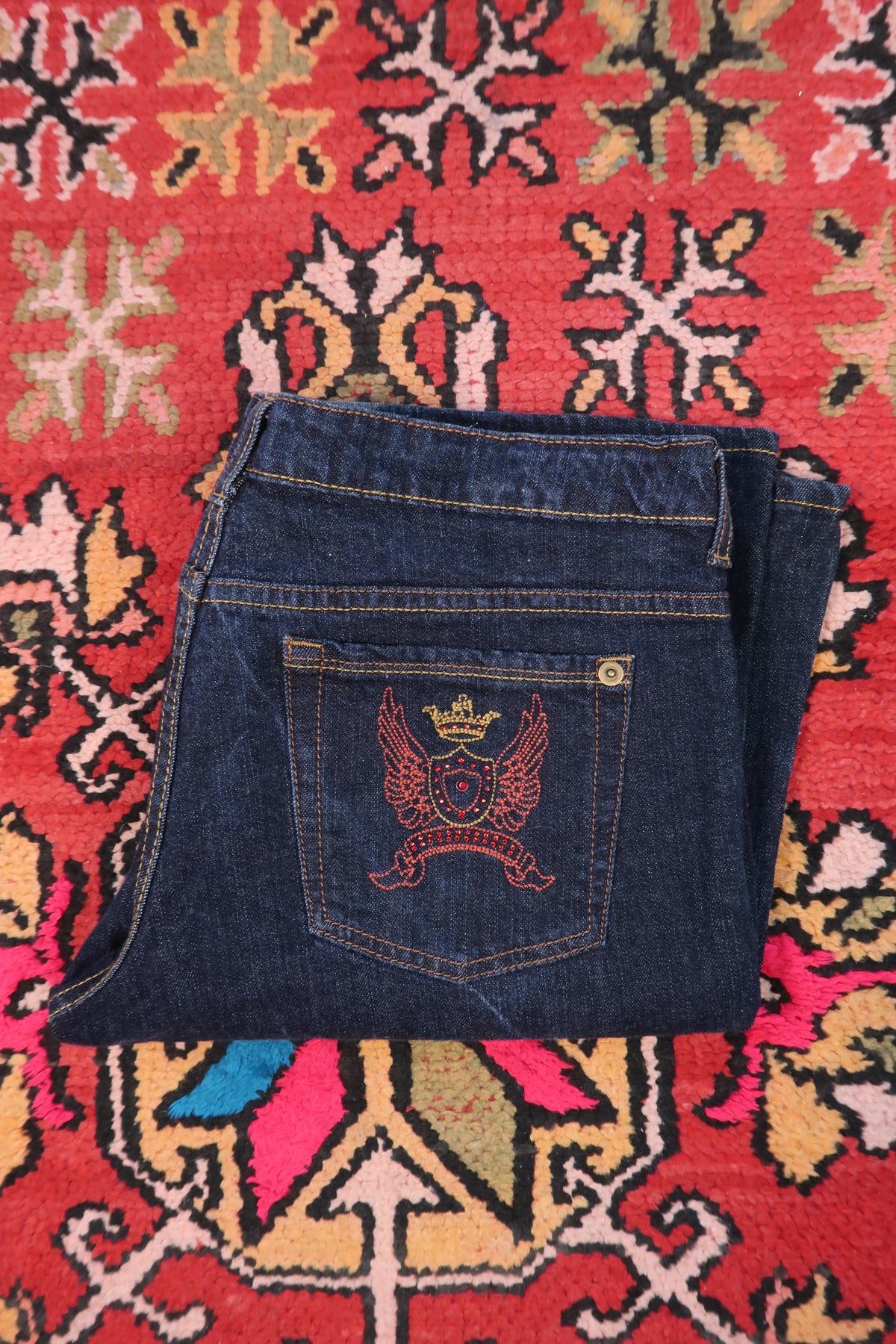 Vintage 2000s No Boundaries embroidered dark wash women's jeans with distressed detailing, from Elektra Vintage.