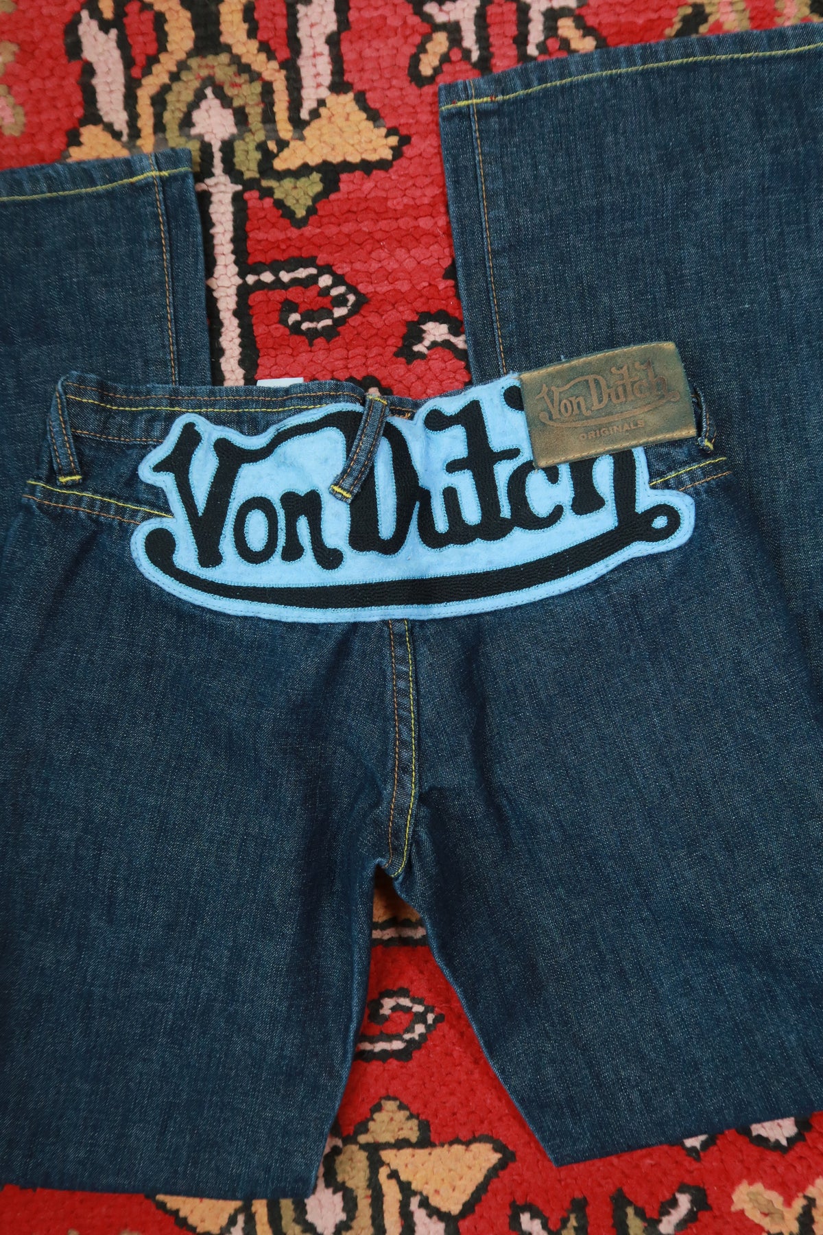 Vintage 2000s Von Dutch low rise bootcut jeans in dark wash denim, size 27, from Elektra Vintage, women's Y2K style.
