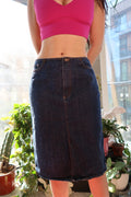 Vintage 2000s DKNY dark wash denim skirt from Elektra Vintage, styled with a classic A-line silhouette and visible stitching.