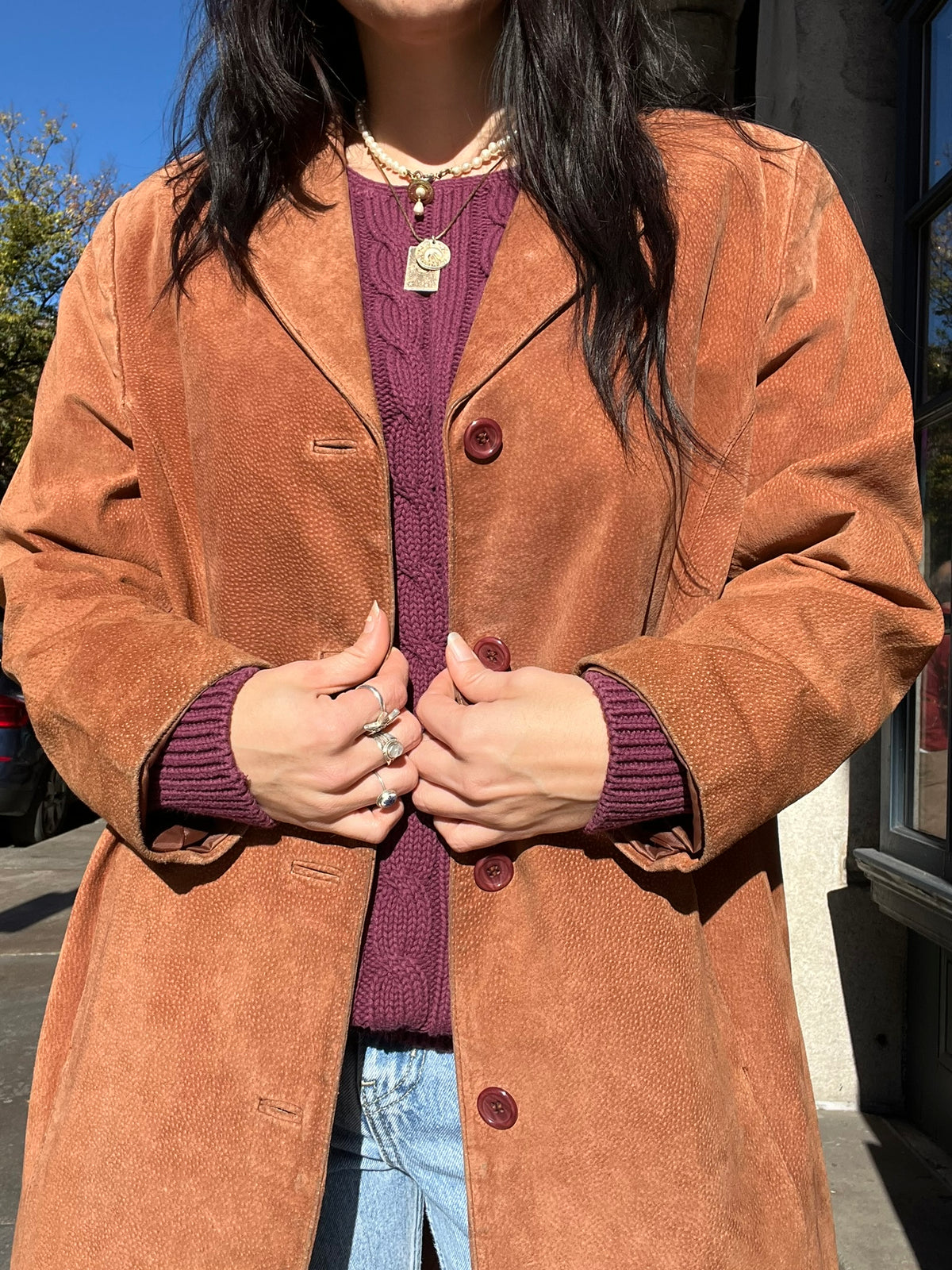 Elektra Vintage suede coat in classic vintage style, featuring a tailored fit and rich leather texture, displayed on a hanger.