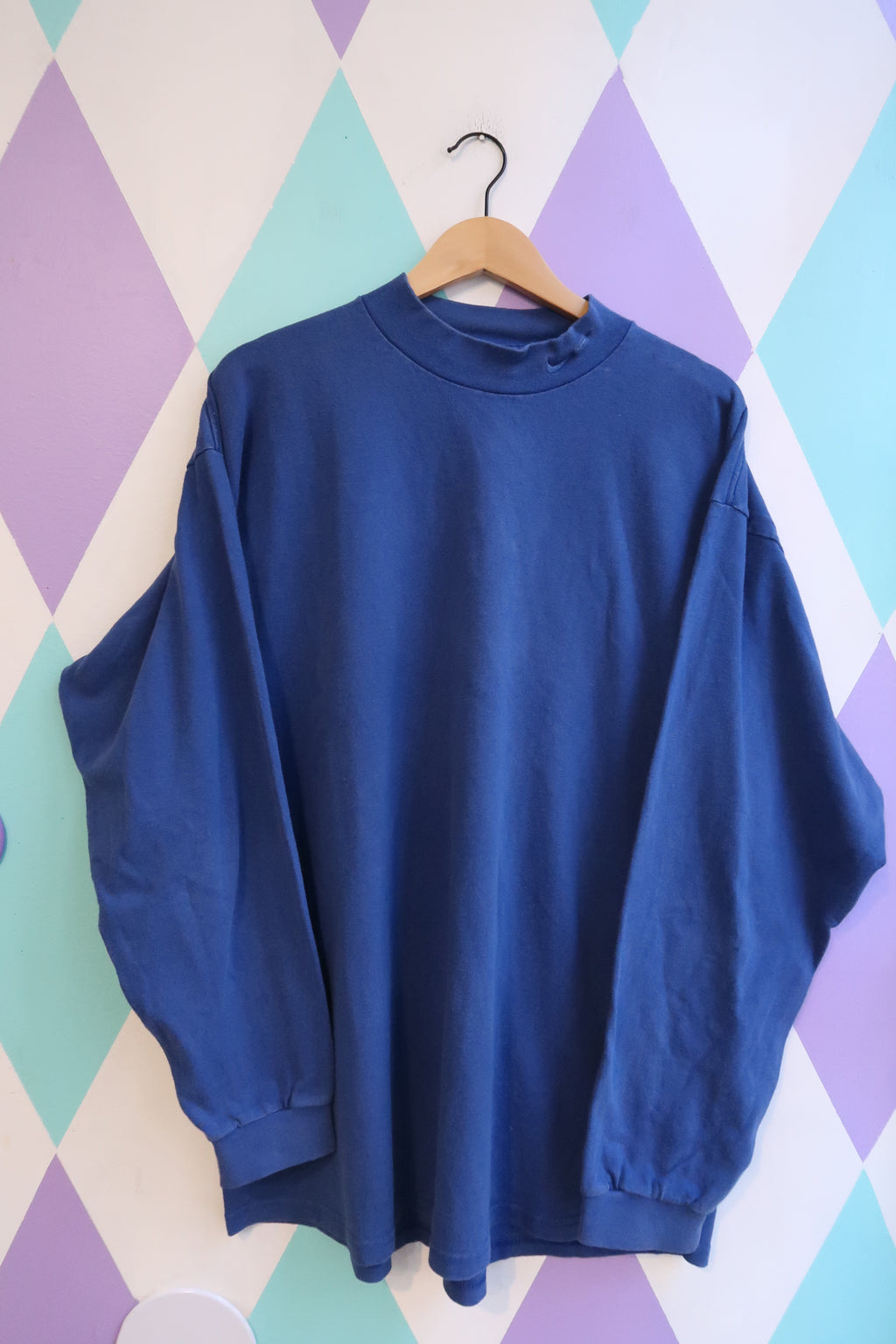 Vintage 90s Nike royal blue mock neck sweatshirt for men, from Elektra Vintage, featuring a classic sporty design.