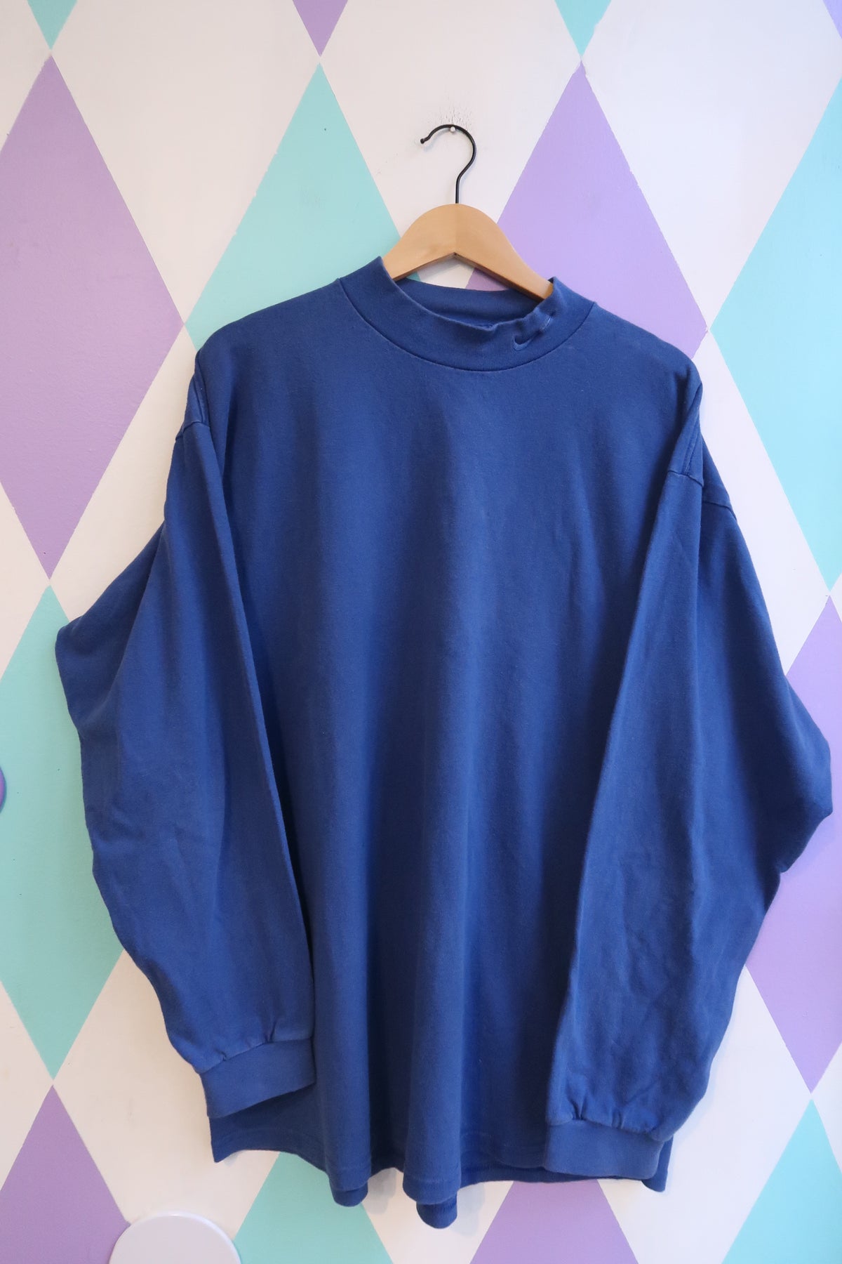 Vintage 90s Nike royal blue mock neck sweatshirt for men, from Elektra Vintage, featuring a classic sporty design.