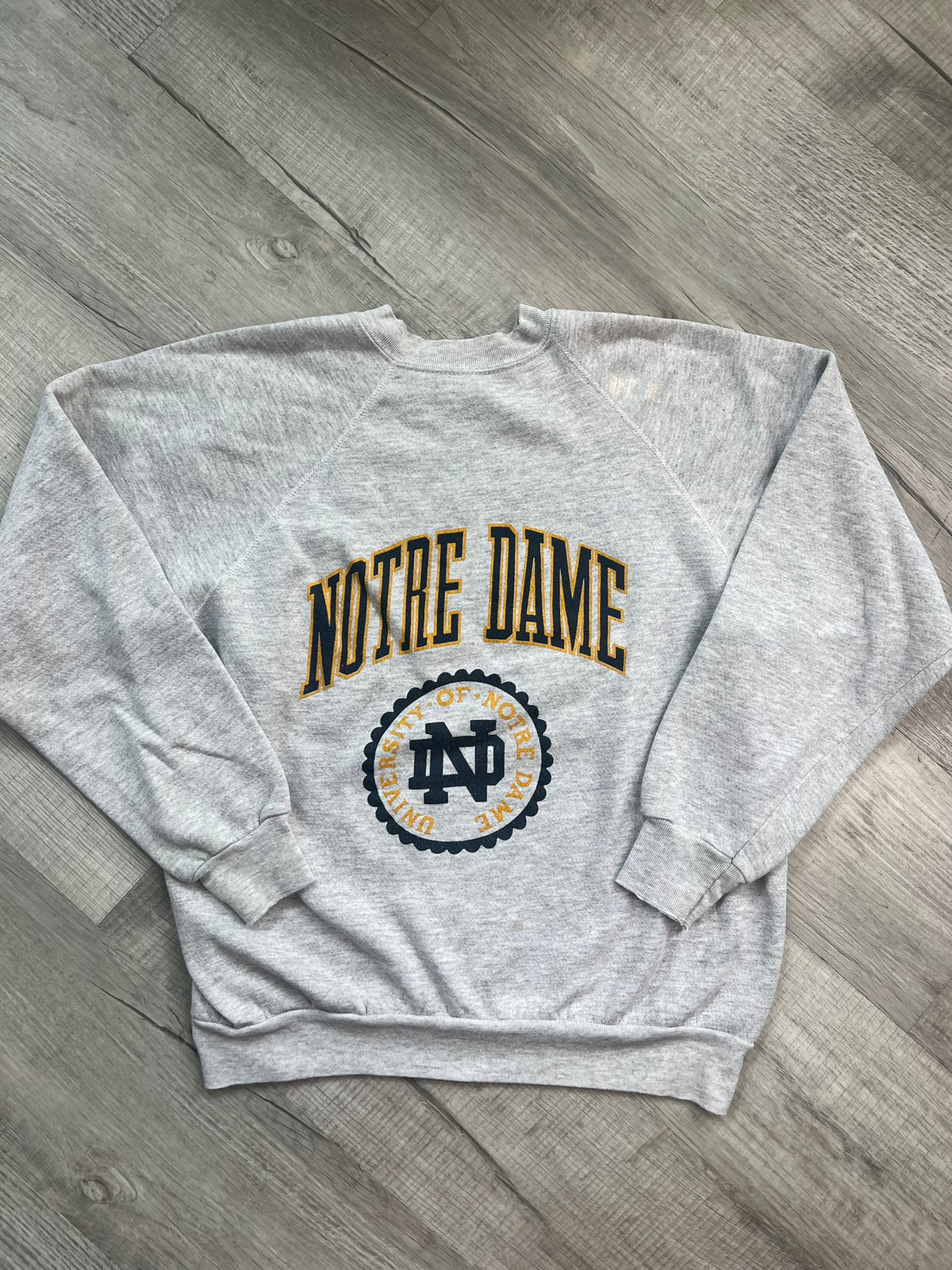 Vintage University of Notre Dame crewneck sweatshirt by Elektra Vintage, featuring classic college logo and comfortable fabric.