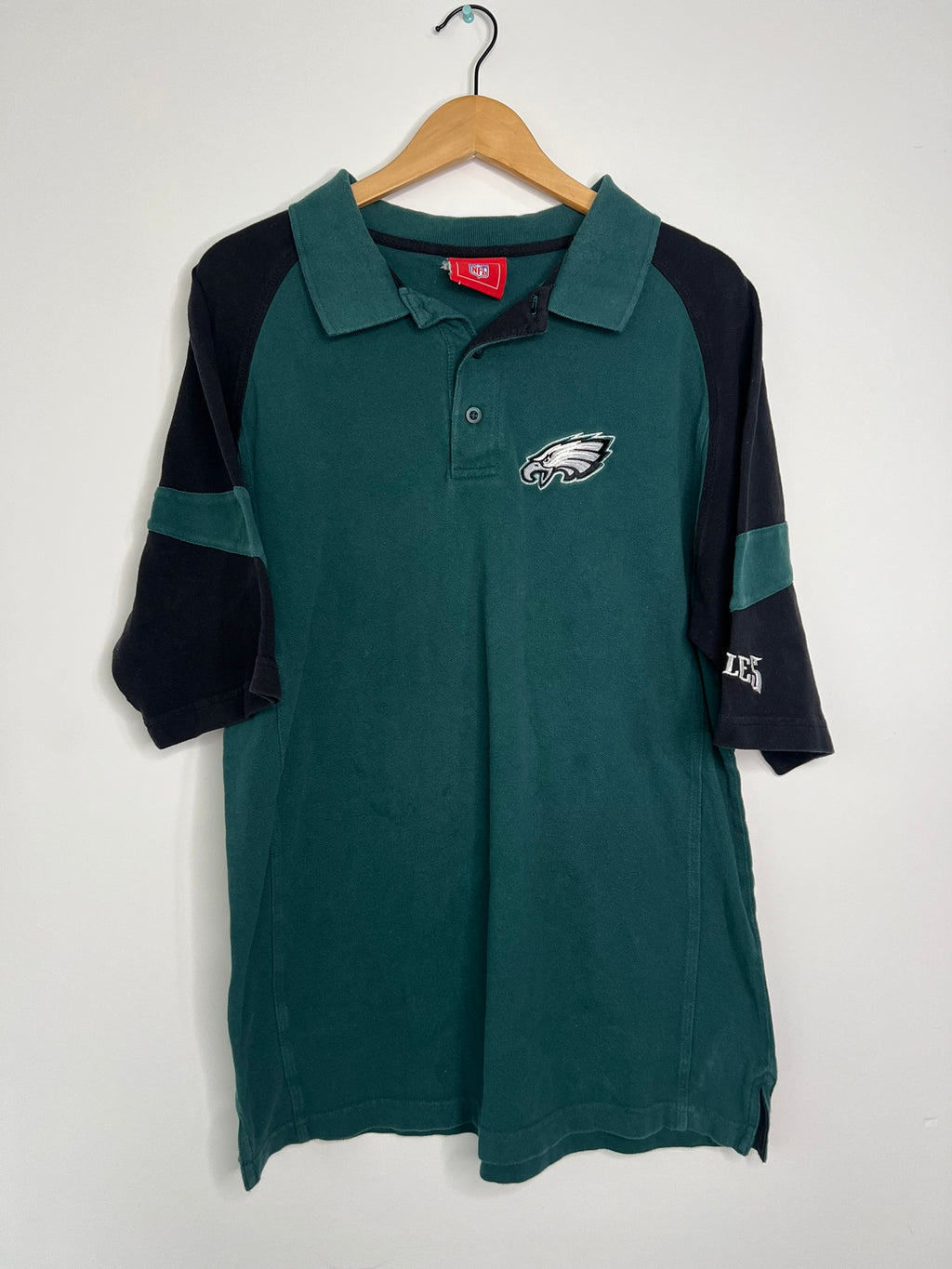Vintage 2000s Eagles polo shirt by Elektra Vintage, featuring classic design and logo on soft cotton fabric.