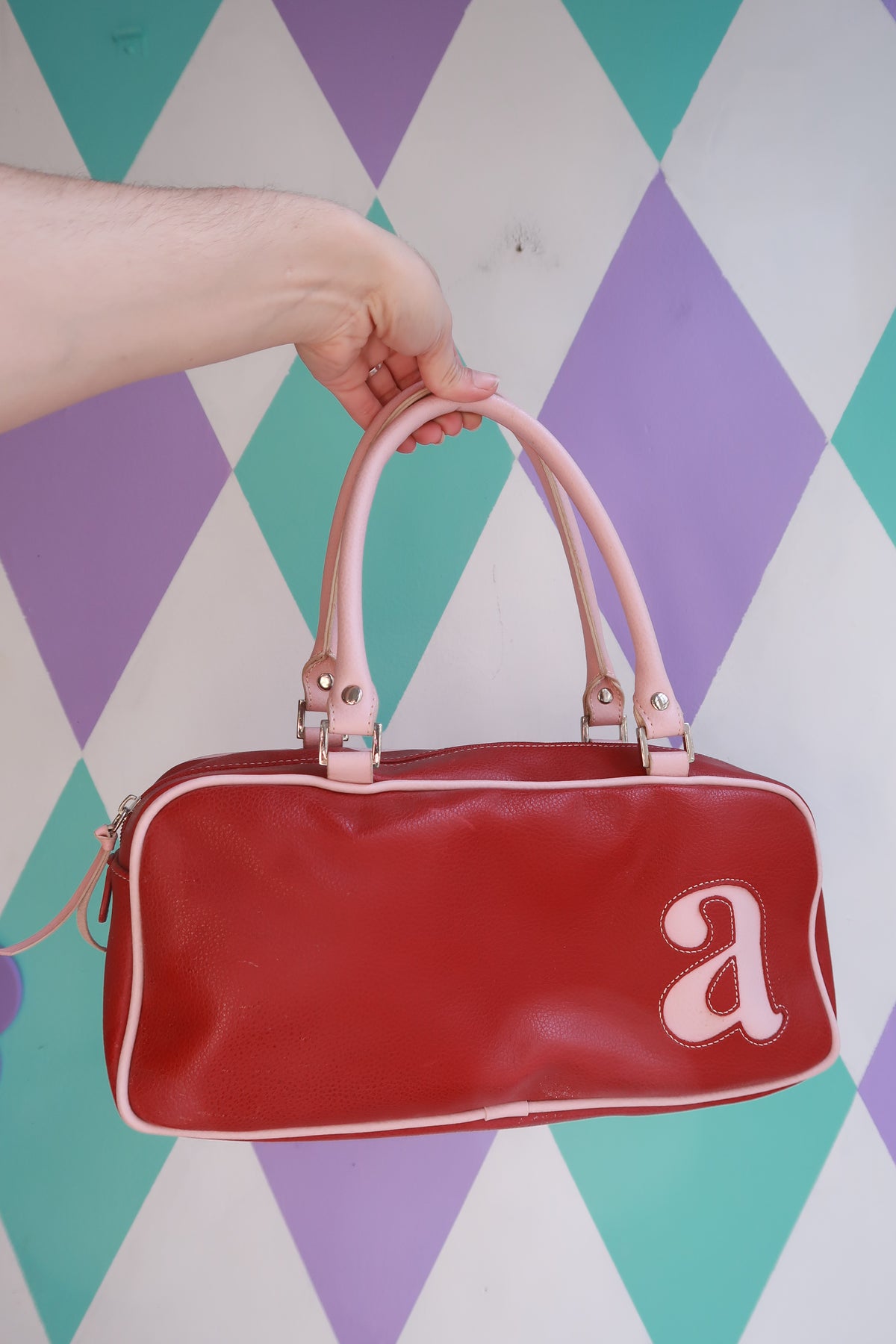 Vintage Y2K red mini bowling bag by Elektra Vintage with pink trim, stylish and compact purse for retro-inspired accessories.