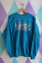Load image into Gallery viewer, Vintage 90s Pike Place Market Seattle crewneck by Elektra Vintage featuring bright teal fabric with fruit and fish graphic design.
