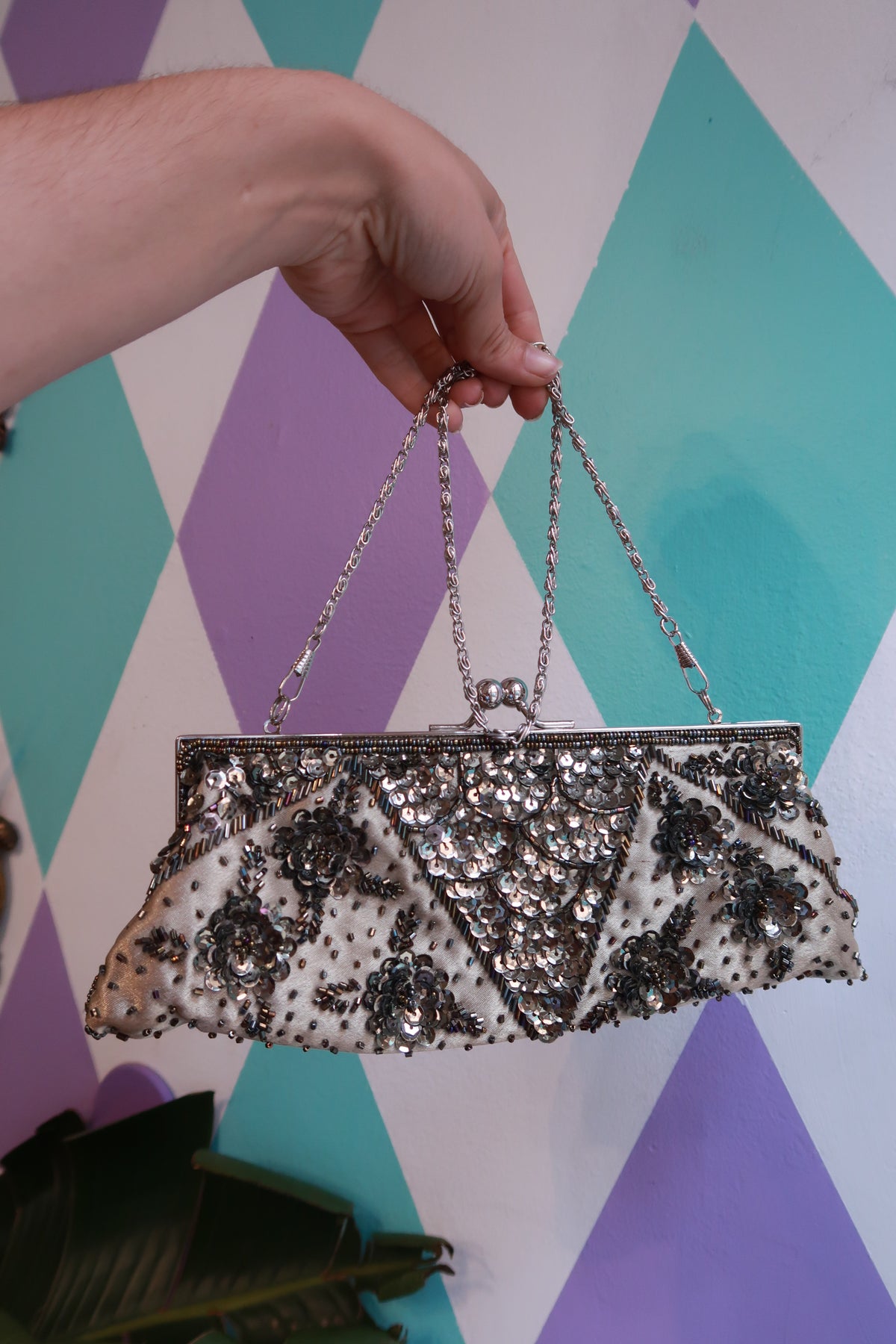 Vintage silver beaded evening clutch bag with sequin floral design and chain strap by Elektra Vintage.