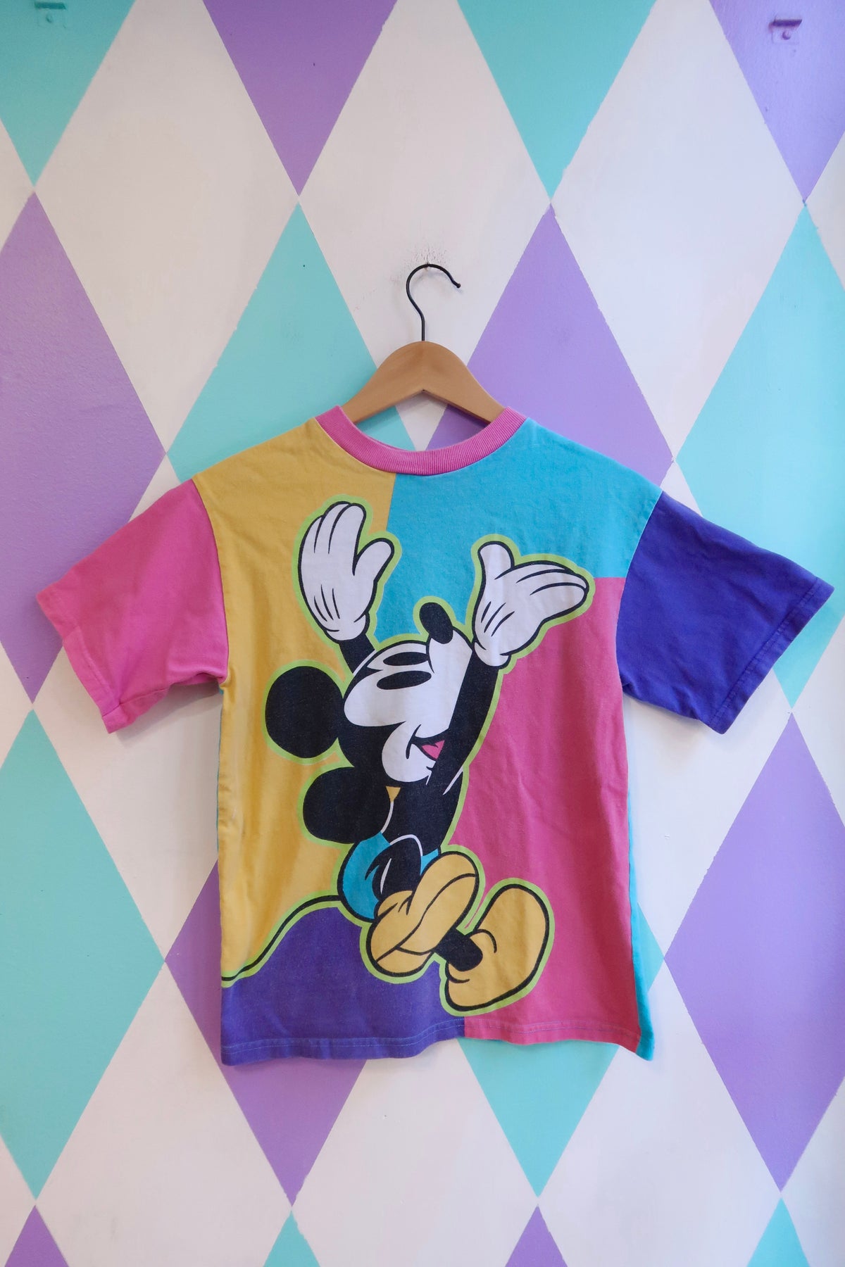 Women's vintage Mickey Mouse colorblock graphic tee by Elektra Vintage featuring all-over Disney print on a casual top.