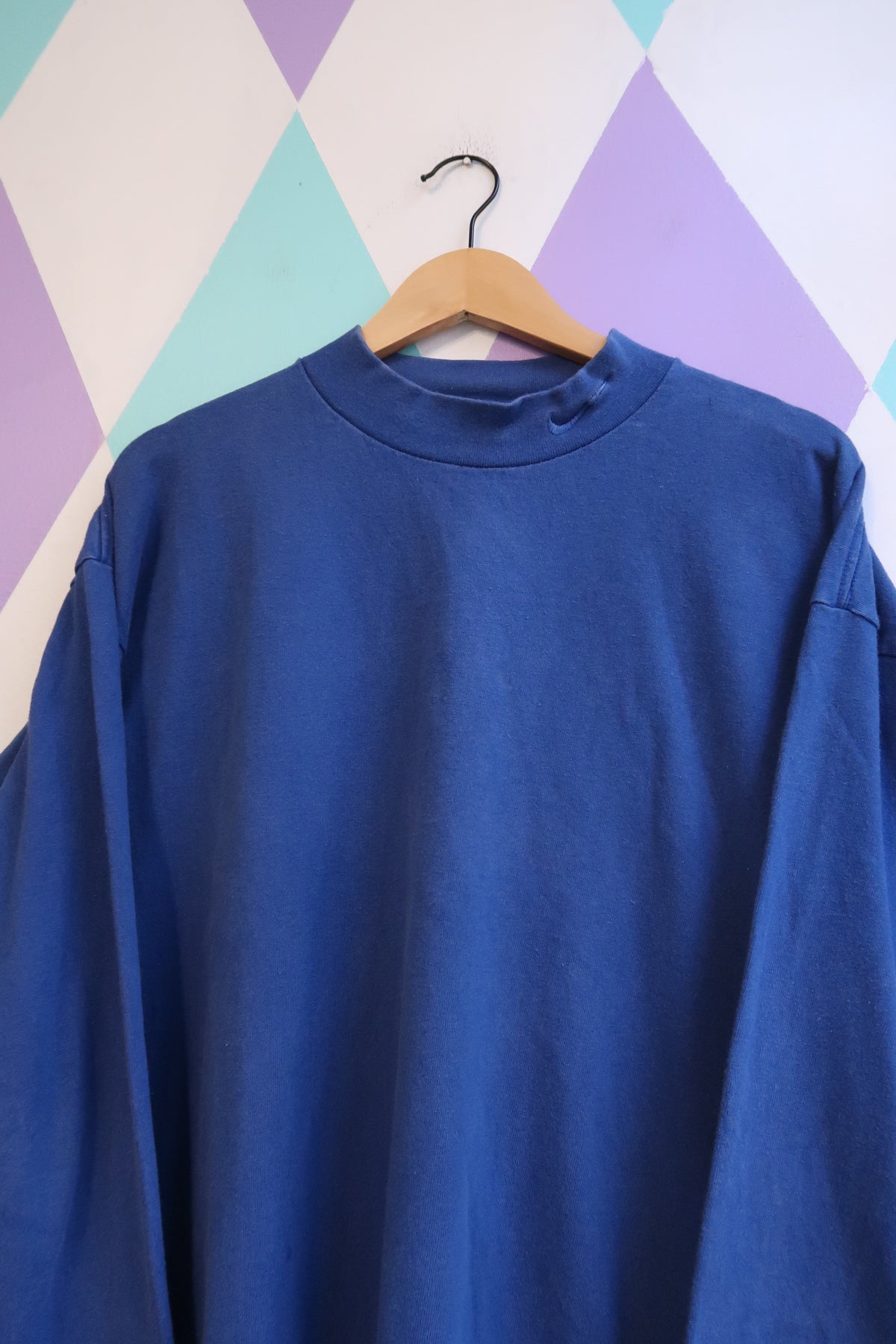 Men's vintage Nike royal blue mock neck sweatshirt by Elektra Vintage, 90s style, soft fabric, and classic athletic design.
