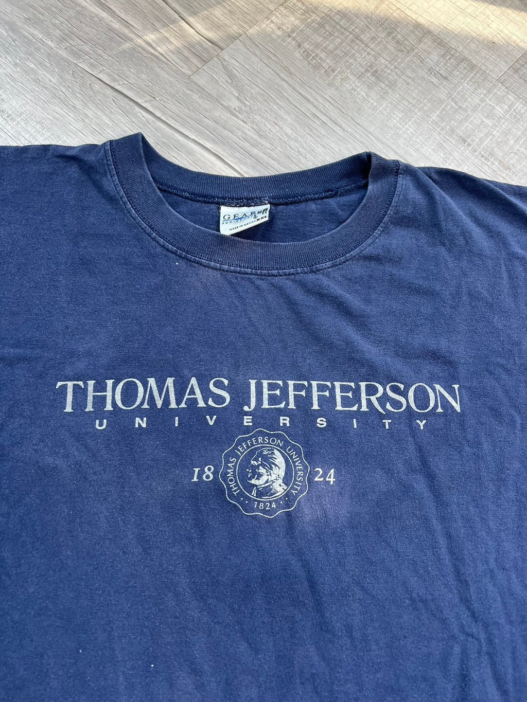 Vintage Thomas Jefferson University graphic T-shirt by Elektra Vintage, featuring a classic university logo and design.