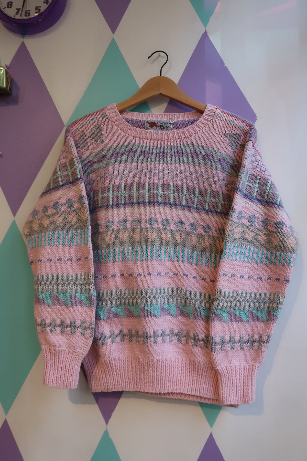 Pink Fair Isle sweater by Chompas Del Peru featuring traditional patterns, styled with a cozy, soft knit fabric.