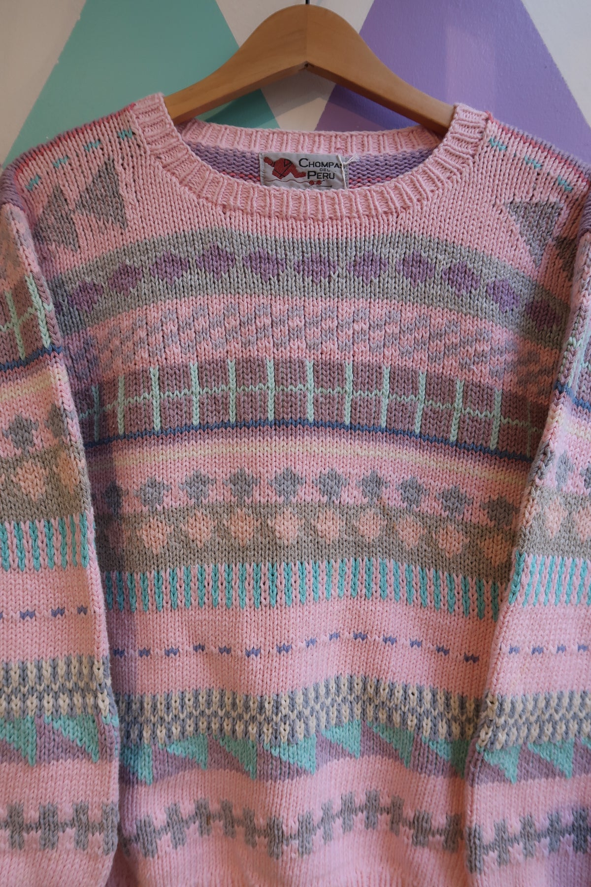 Pink Fair Isle sweater by Chompas Del Peru featuring traditional knit patterns, styled by Elektra Vintage.