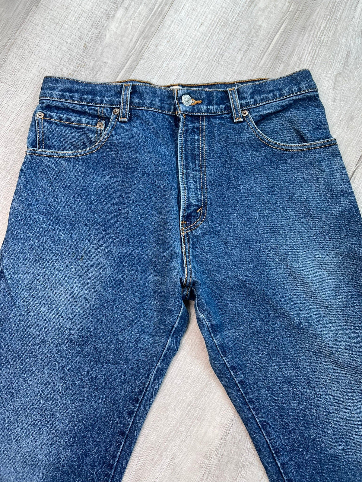 Men's Indigo Wash Levi's 517 Bootcut Style Jeans in dark blue denim with classic five-pocket design and straight leg fit.