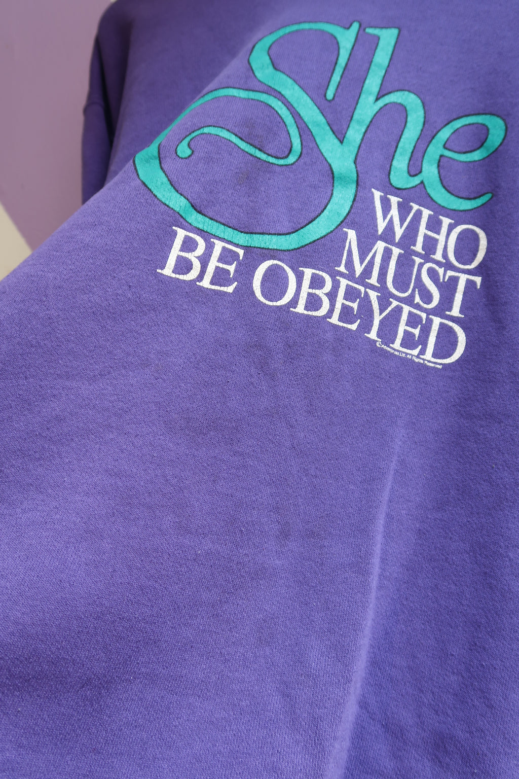 Vintage “She Who Must Be Obeyed” Graphic Sweatshirt – Purple with Teal Collar