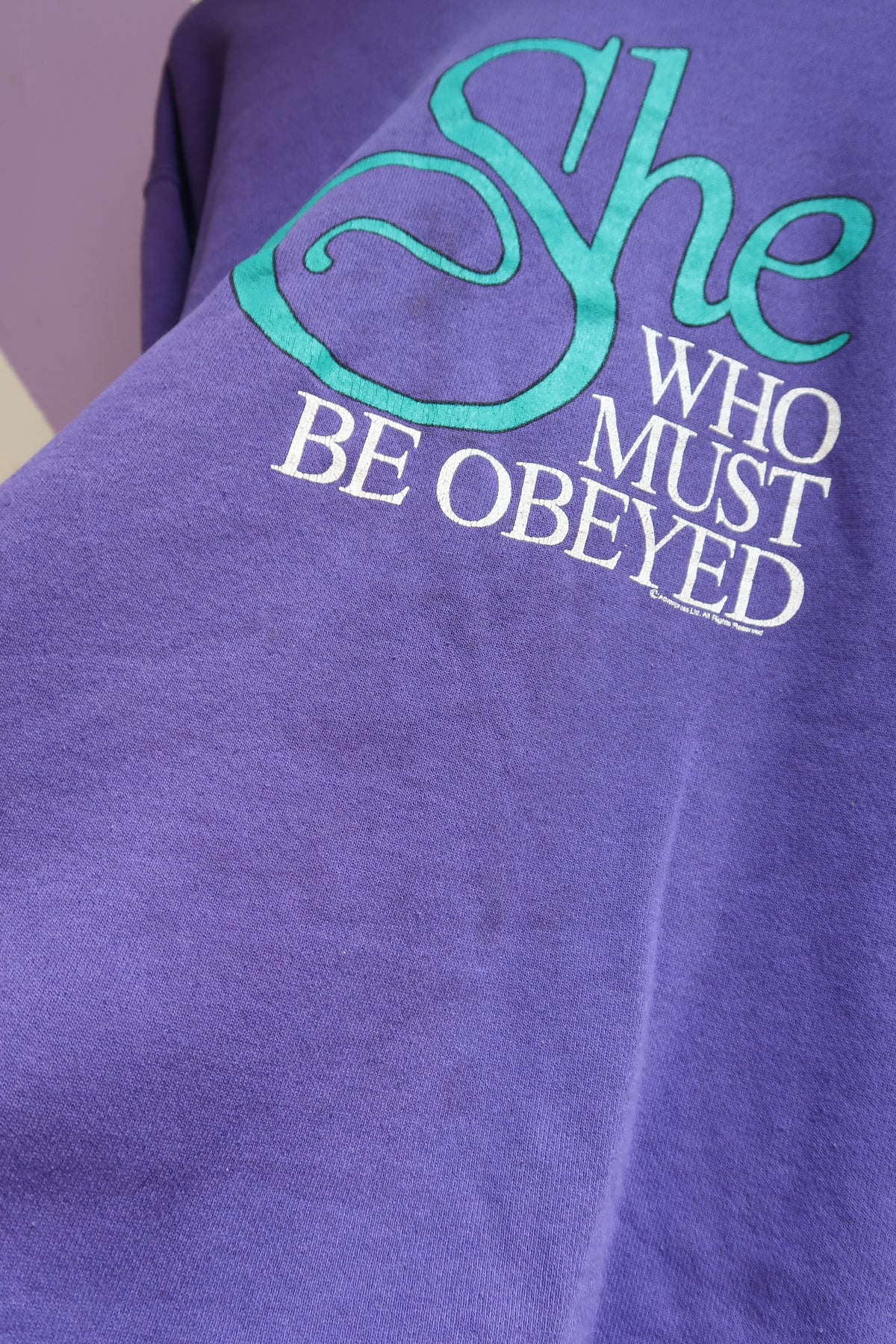 Vintage “She Who Must Be Obeyed” Graphic Sweatshirt – Purple with Teal Collar