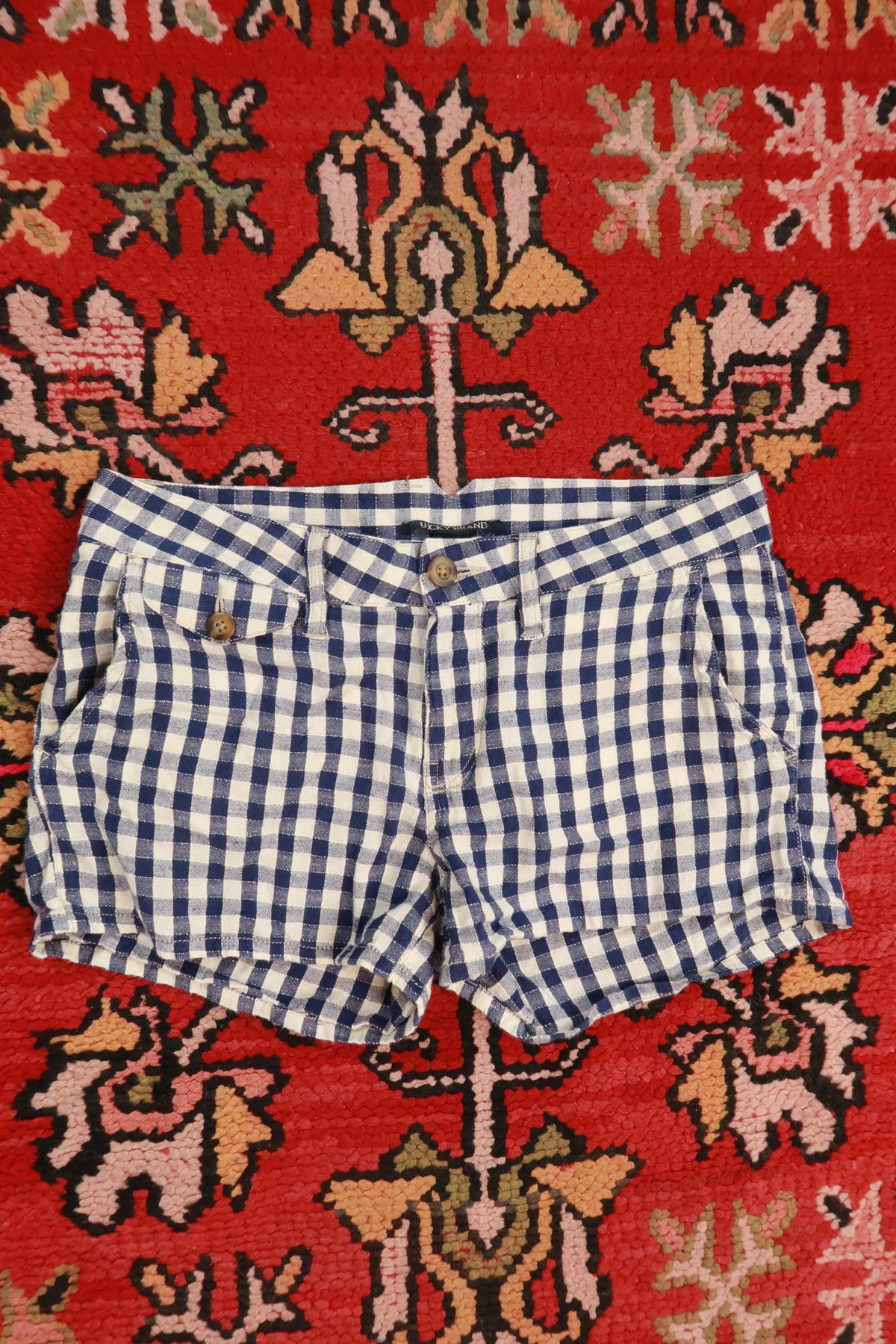 Women's Lucky Brand navy blue gingham linen blend shorts with a vintage 2000s style, shown on a model.