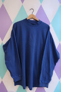 Men's vintage Nike royal blue mock neck sweatshirt with long sleeves, classic 90s style from Elektra Vintage.