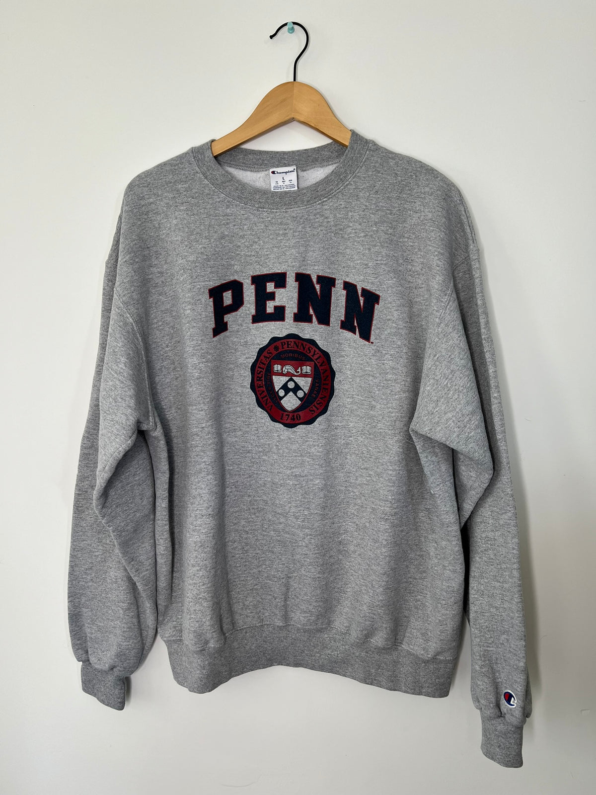 Elektra Vintage UPenn graphic crewneck sweatshirt with university logo in white on navy fabric, casual and comfortable style.