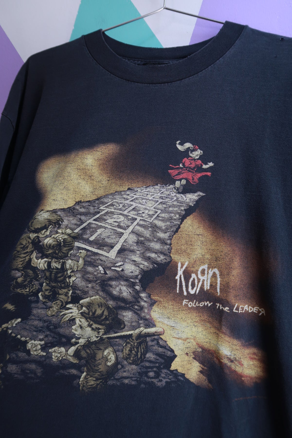 Men's black graphic long sleeve tee by Elektra Vintage featuring vintage 1998 Korn "Follow the Leader" band design.