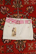 Vintage white denim mini skirt by Elektra Vintage with pink stripe belt, Y2K style, casual and trendy fashion piece.