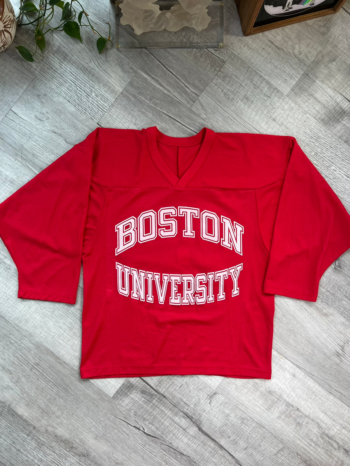 Vintage Boston University hockey jersey by Elektra Vintage, featuring classic team logo and retro athletic design.