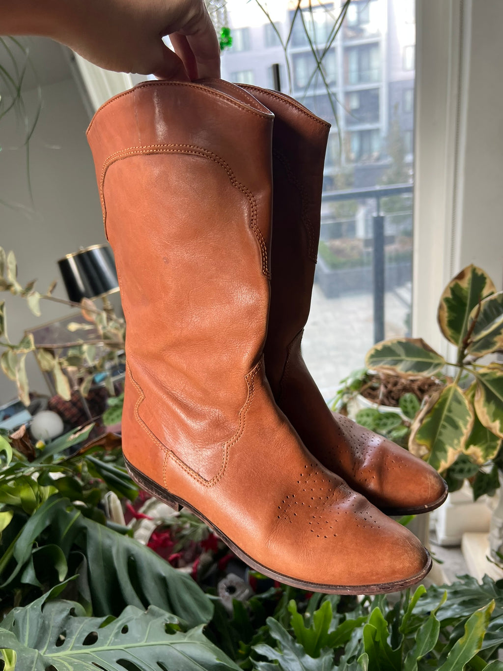 Vintage tan western cowboy boots by Elektra Vintage featuring classic design and intricate stitching details.